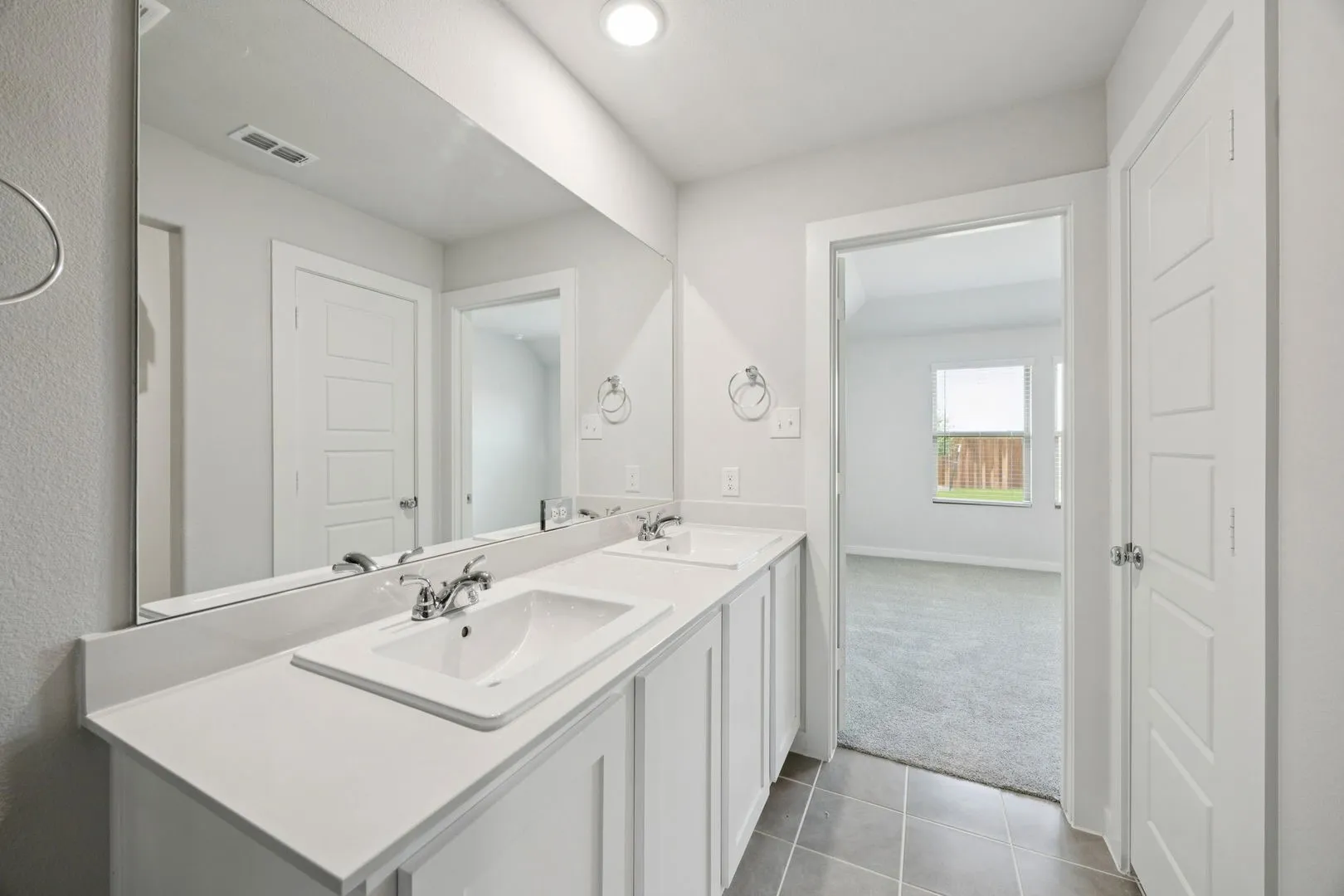 Primary Bathroom in the Hadley home plan by Trophy Signature Homes – REPRESENTATIVE PHOTO