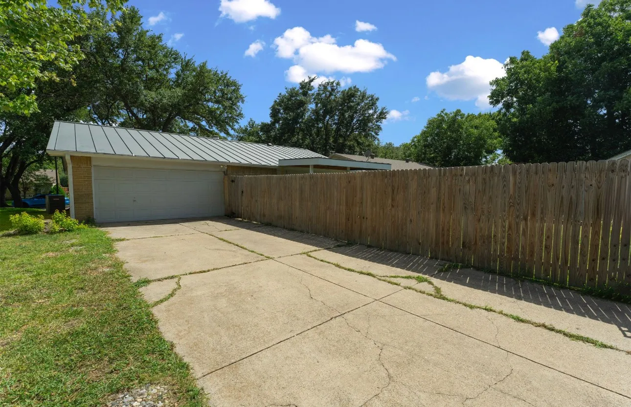 Attached two-car garage with a metal roof