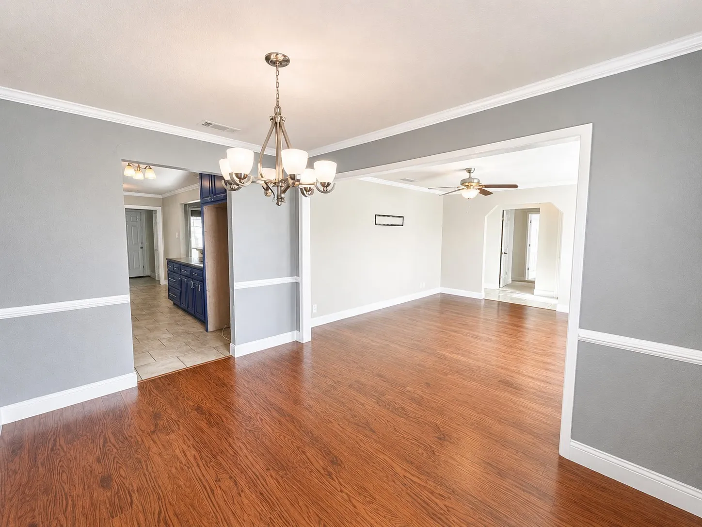 Dining Area with decorative lighting Wood-style flooring