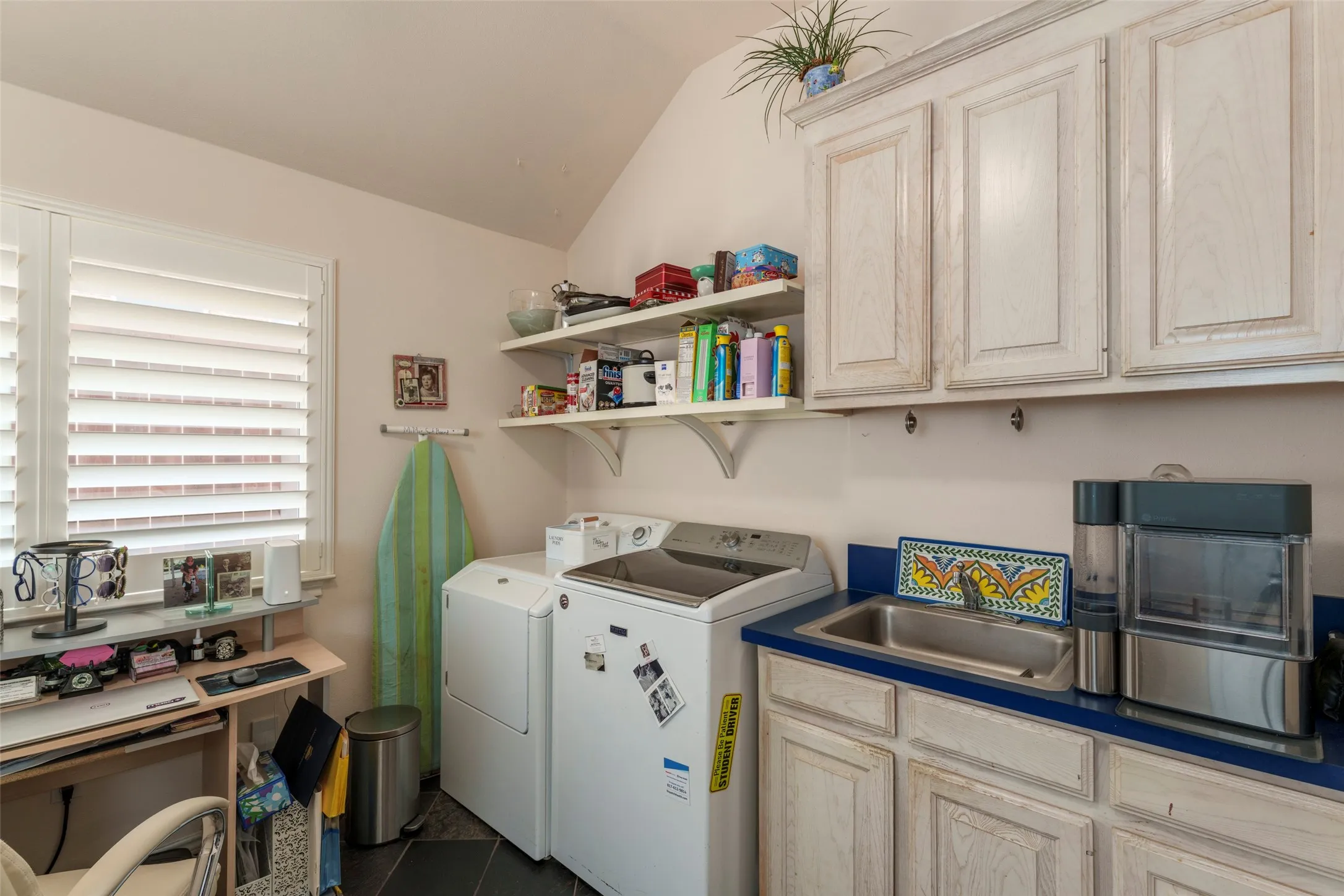 Tons of room for washer/dryer with cabnetry and sink