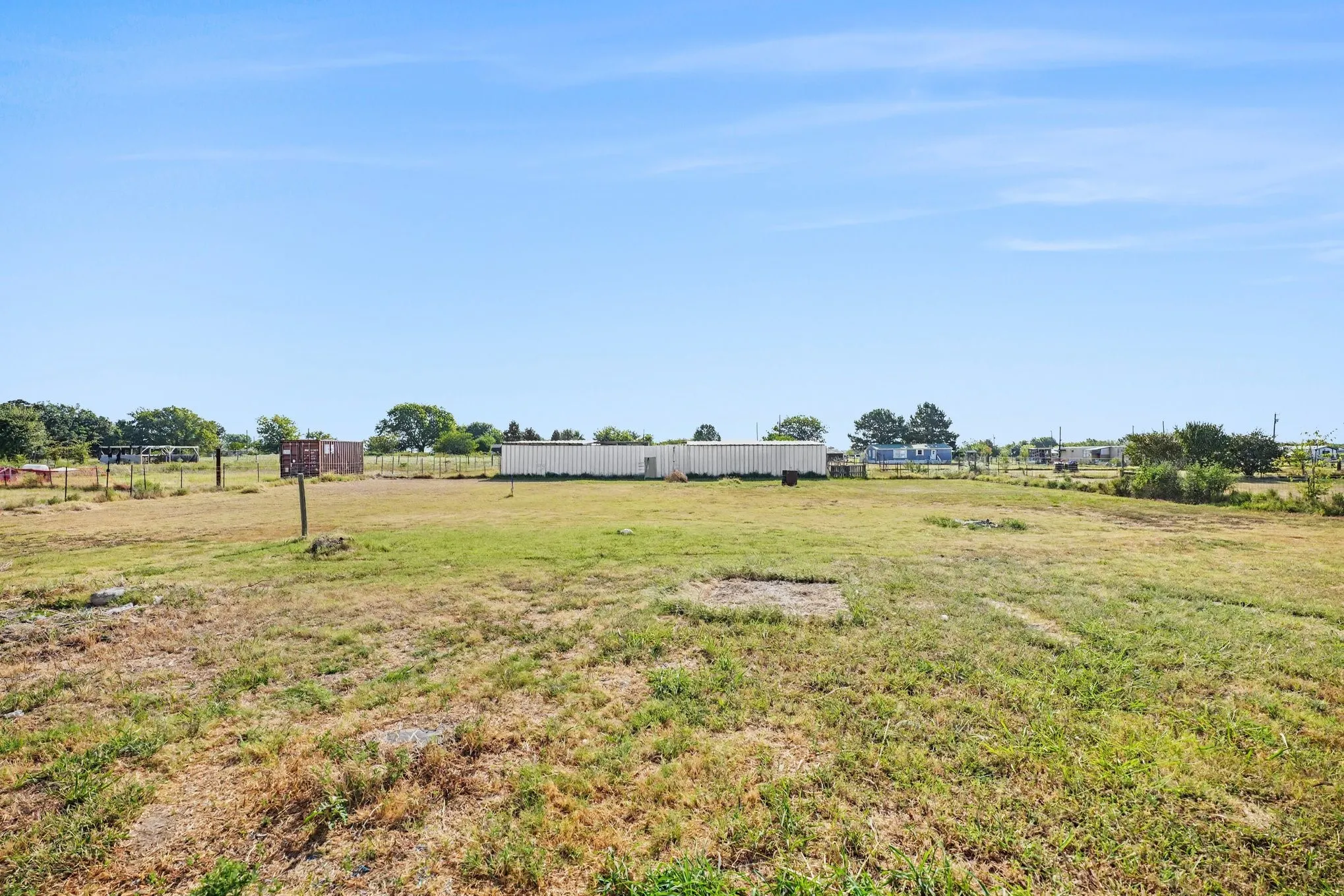 Expansive open land with a clear blue sky overhead