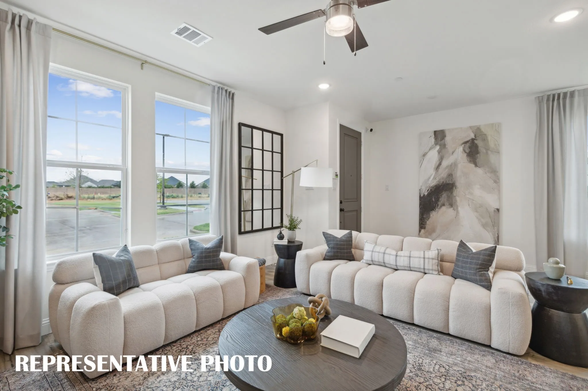 The family room in our Parker plan is large enough to host the entire family!  REPRESENTATIVE PHOTO