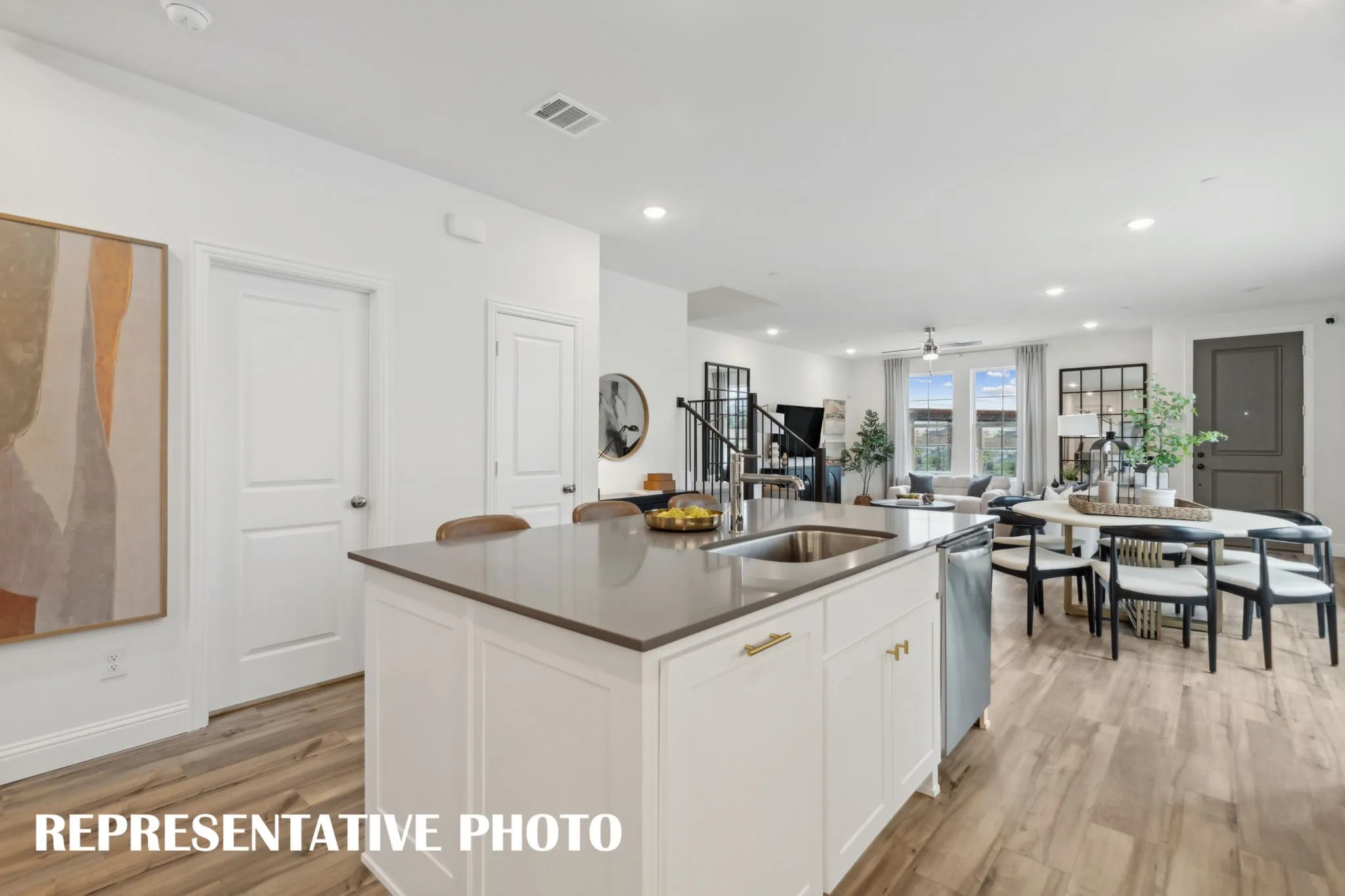 Our Parker plan offers an open and flowing main level so the chef will never be left out of the party!  REPRESENTATIVE PHOTO