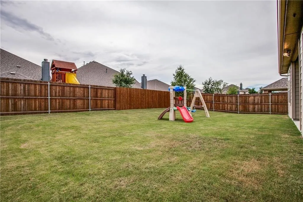 Expansive lawn with a full privacy fence