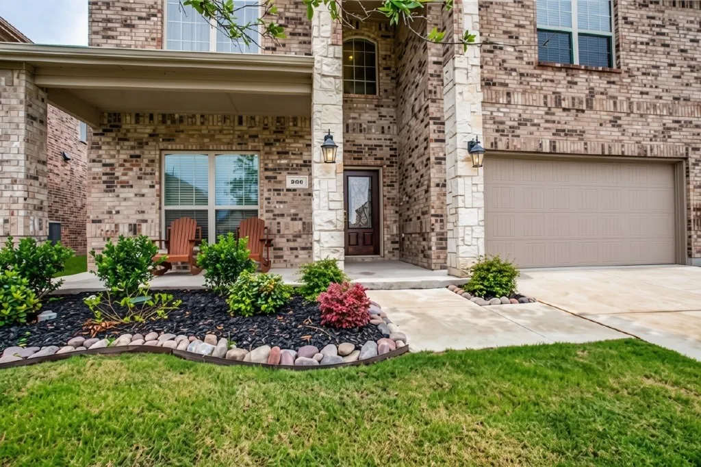 Brick and stone facade with an arched entry