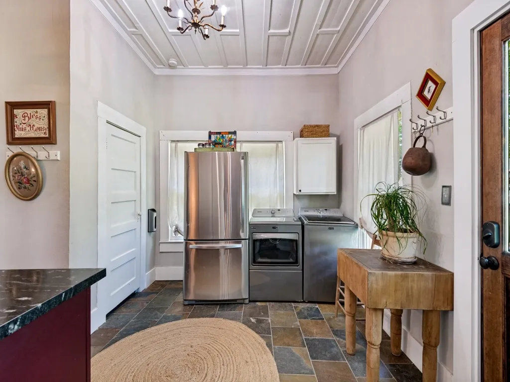 Laundry area with door to back yard.