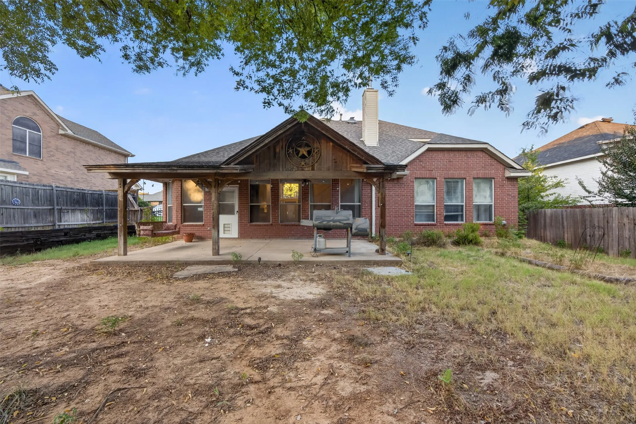 Brick exterior with a covered patio