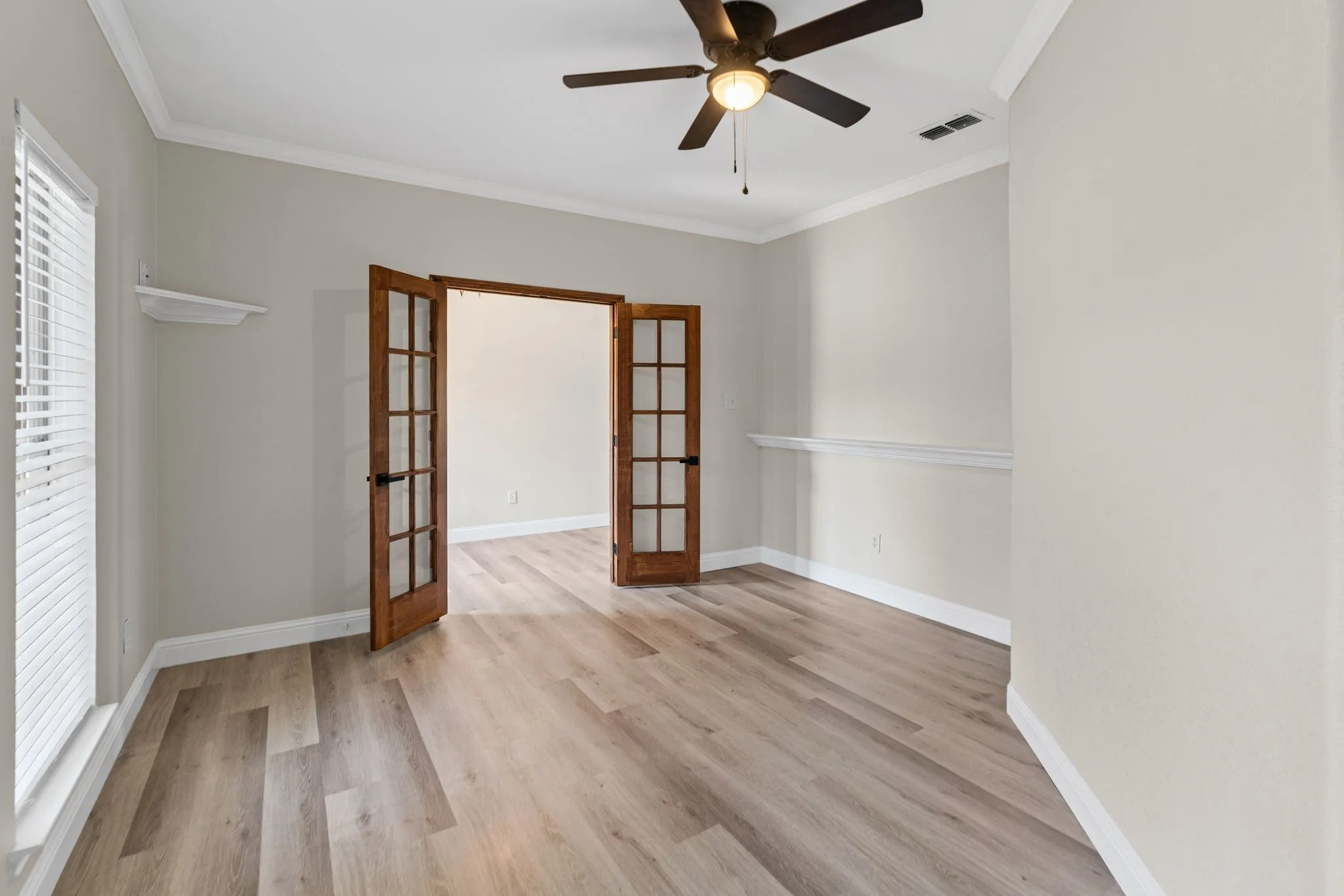 Multi-purpose room would work well as a home office, playroom, or a family room.