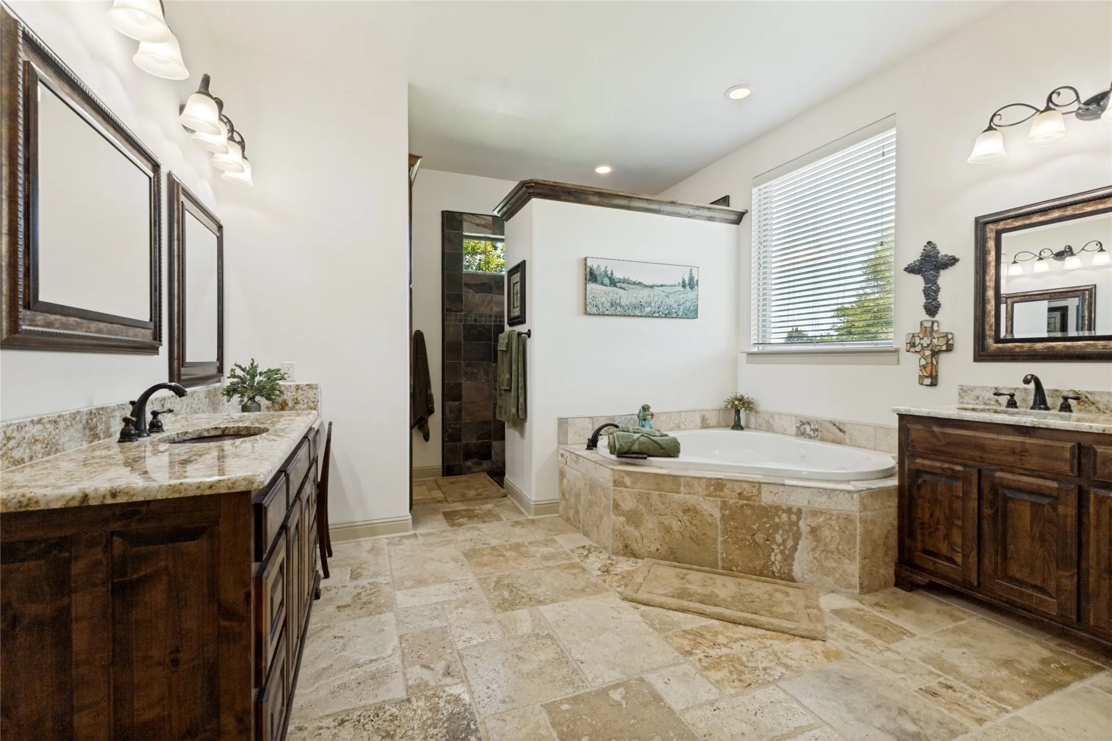 Dual vanity with granite countertops, recessed lighting, tile flooring, built-in soaking tub, and a separate walk-in shower