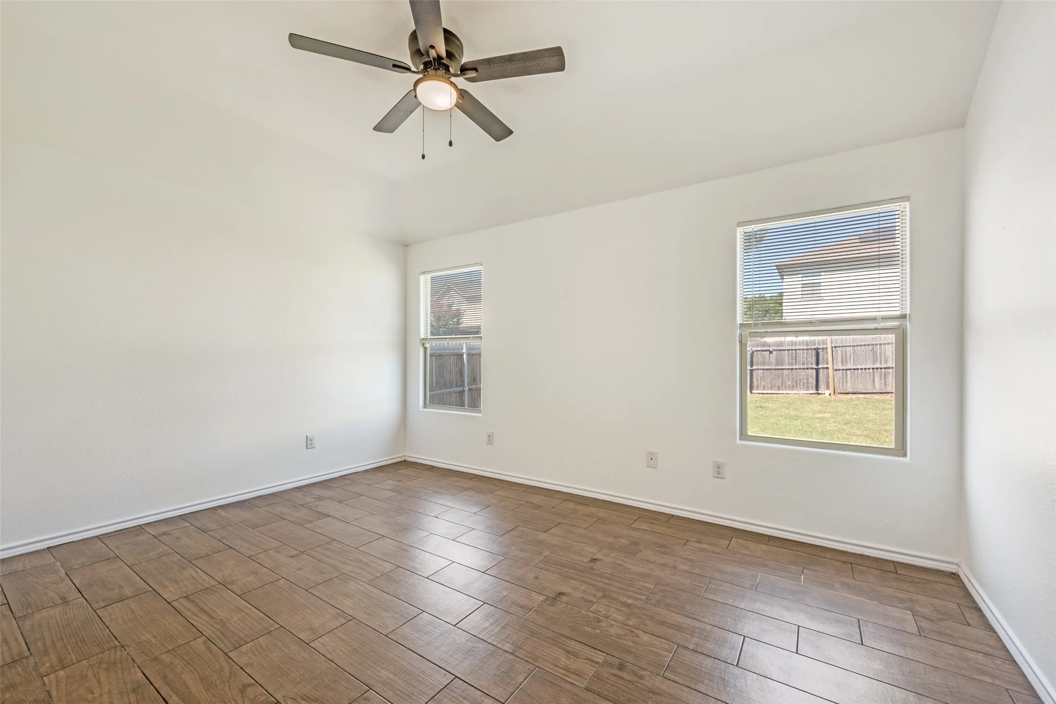 no carpet! plenty of light and a ceiling fan to keep you cool