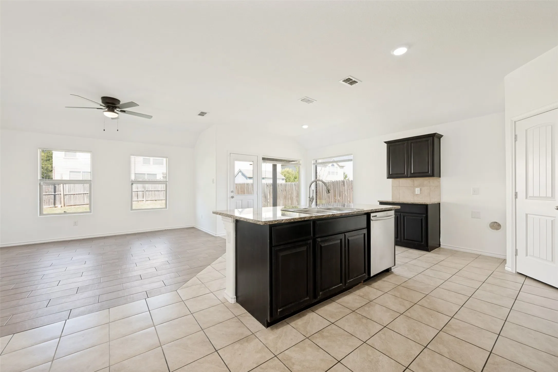 Lots of light, nice sized kitchen island and a pantry to the right