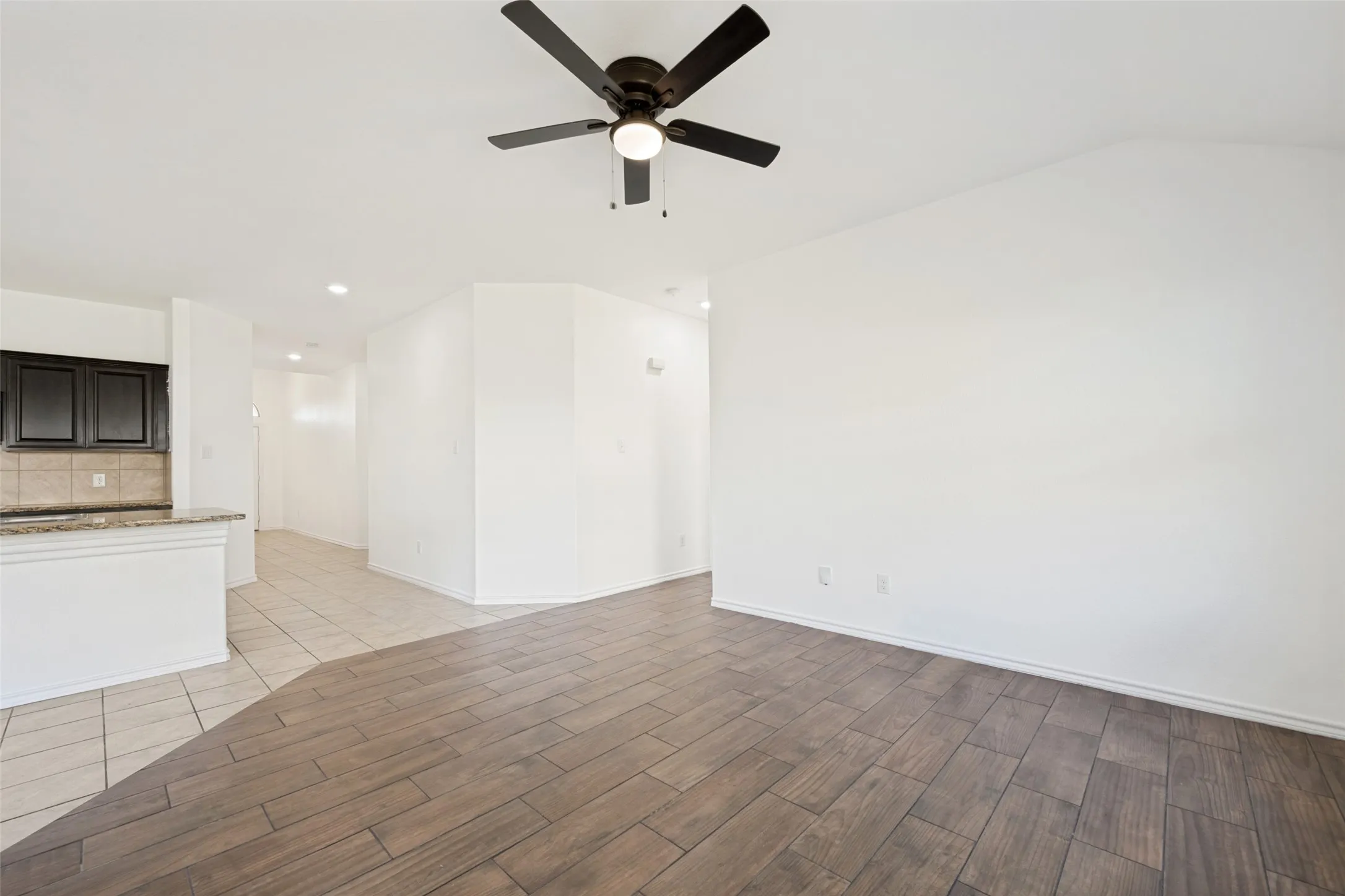 Kitchen on the left, overlooking the living room