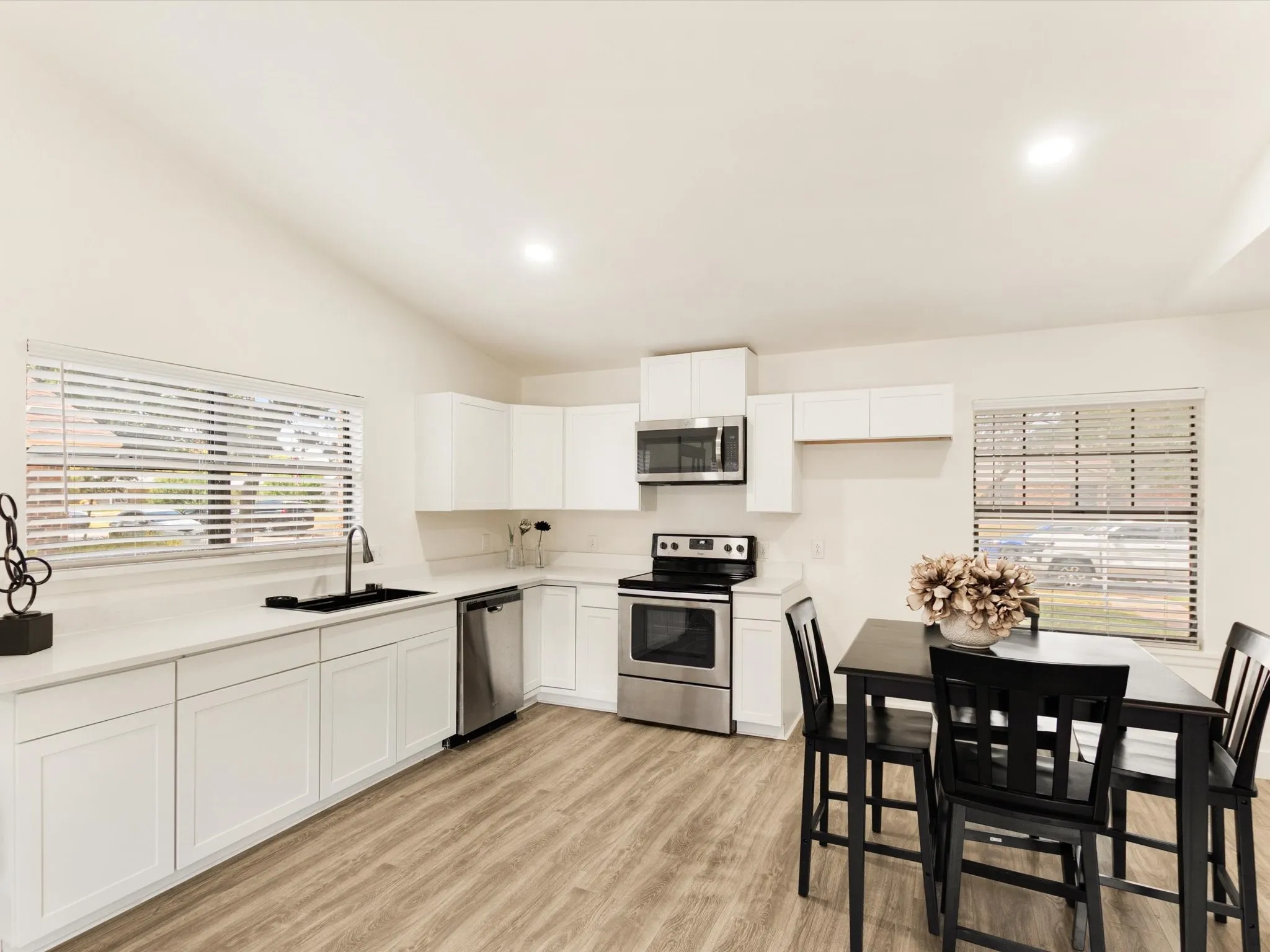 Vaulted ceilings complement the wood-finish flooring