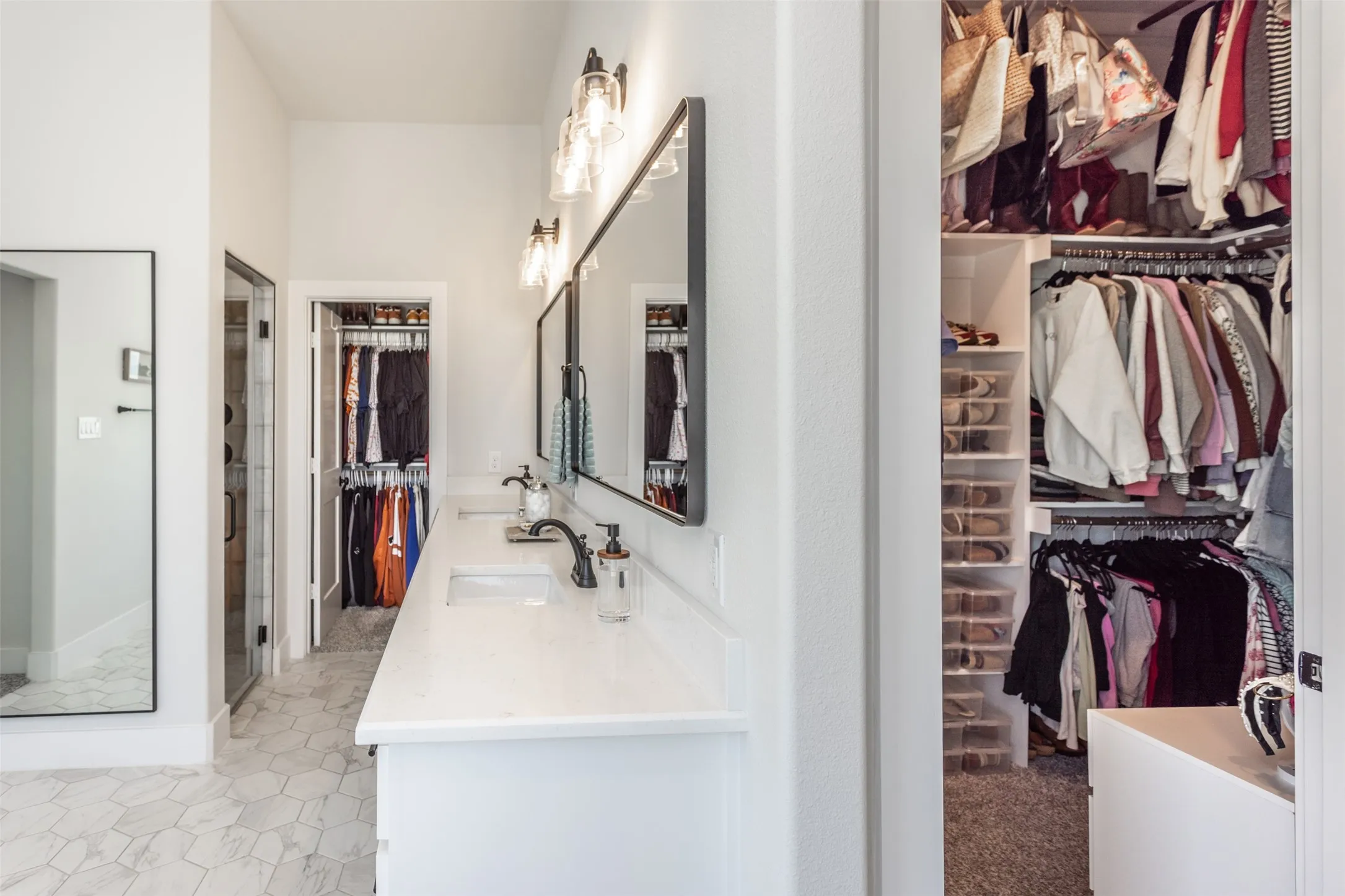 Dual vanity with white countertop, dual undermount sinks, and matte black fixtures