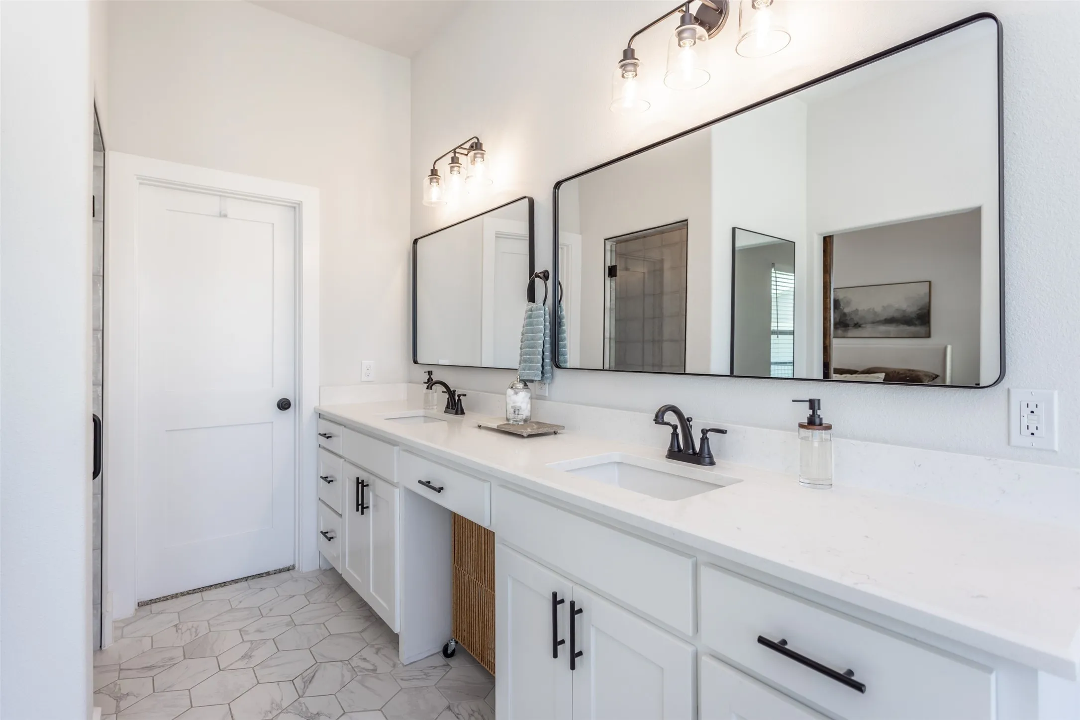 Dual vanity with white cabinetry and integrated sinks