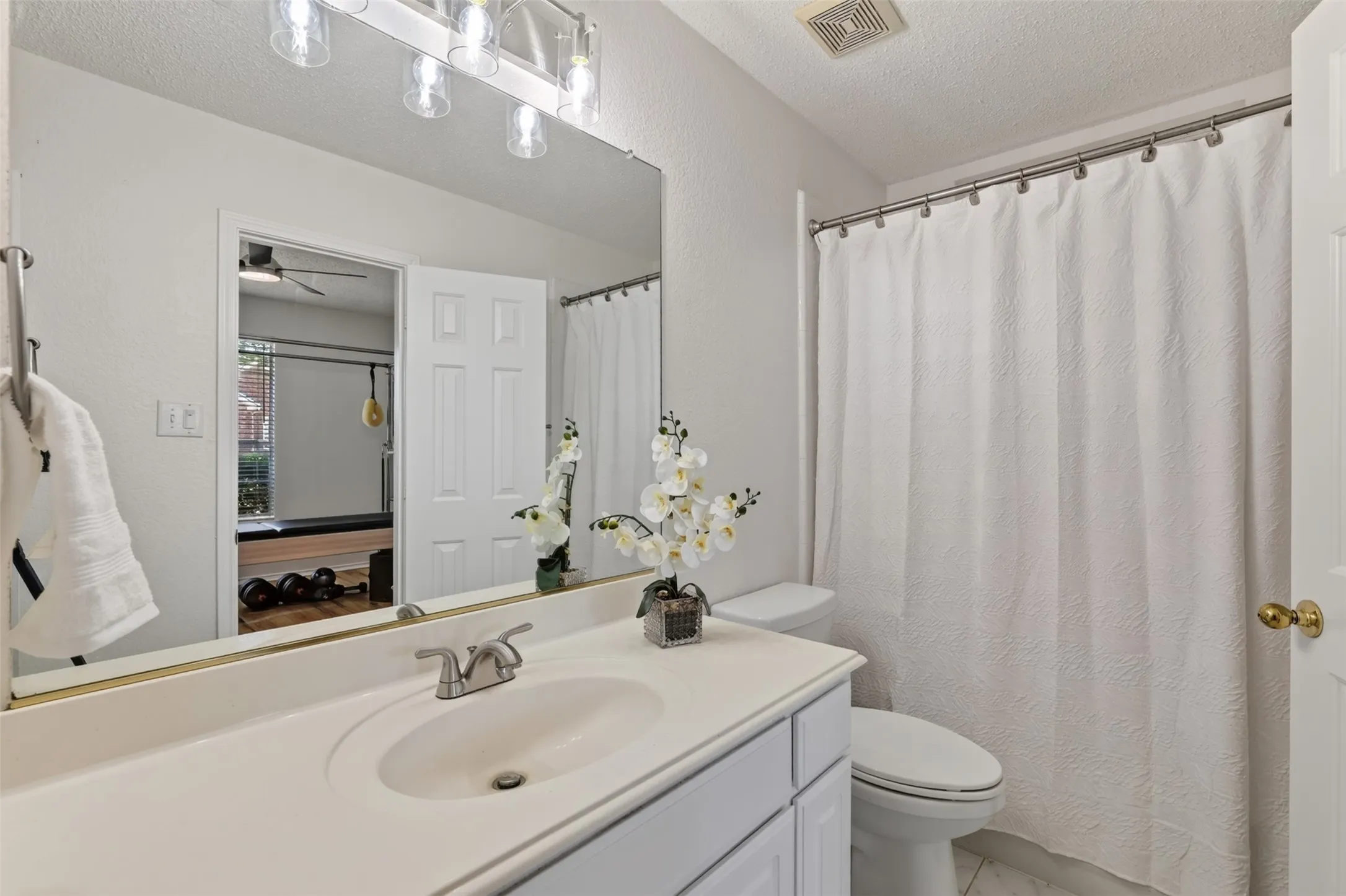 First Floor Full Bathroom off bedroom.
