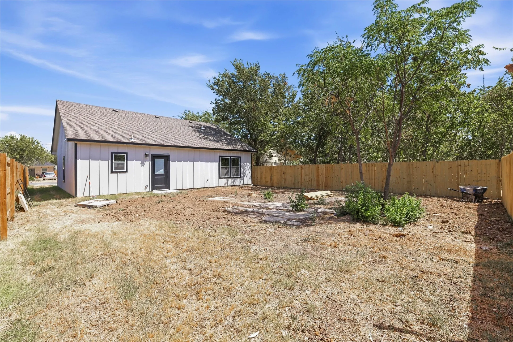 Private backyard with a wood privacy fence