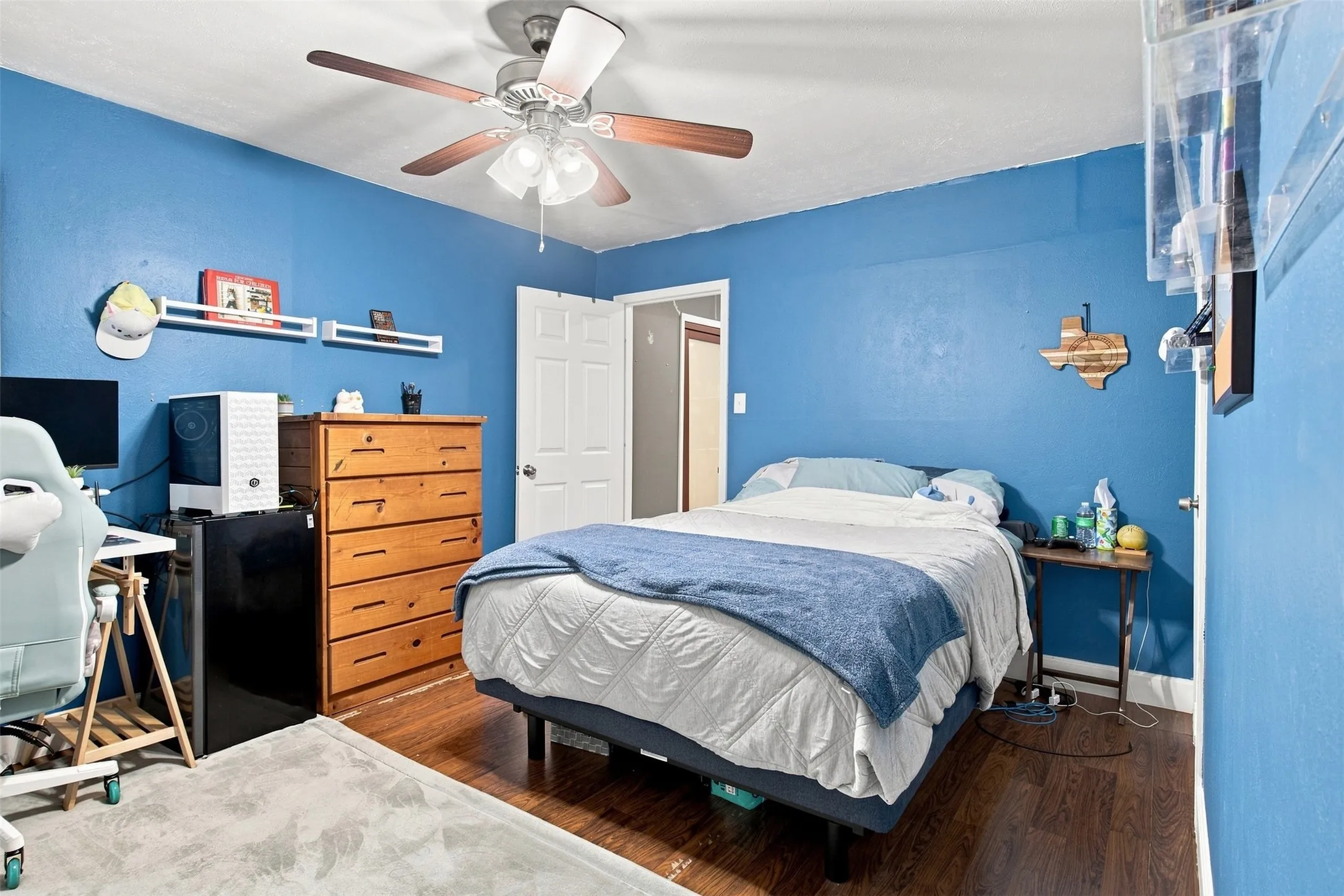 Wood-finish flooring with a ceiling fan light fixture