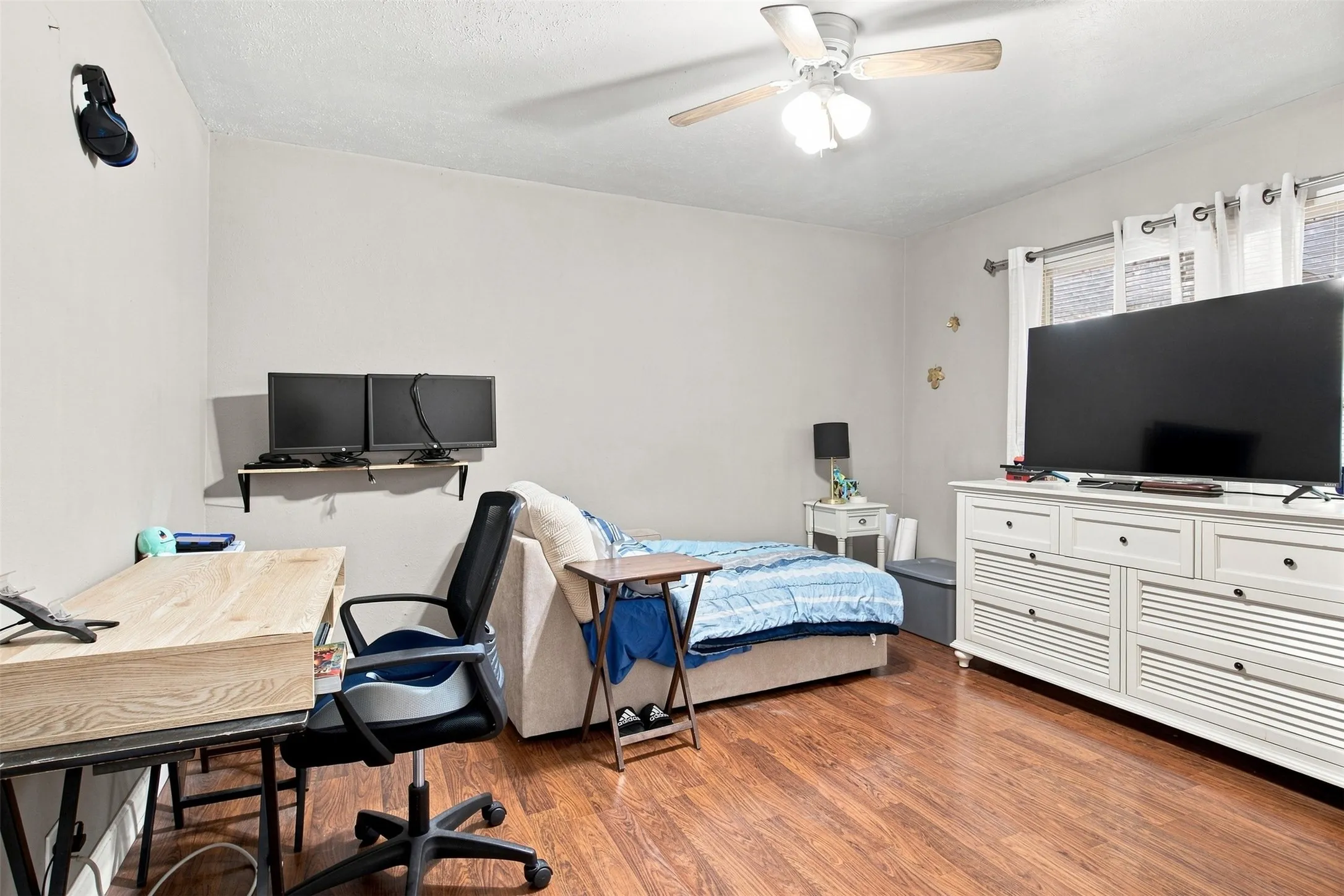 Wood-finish flooring with a ceiling fan with integrated lighting