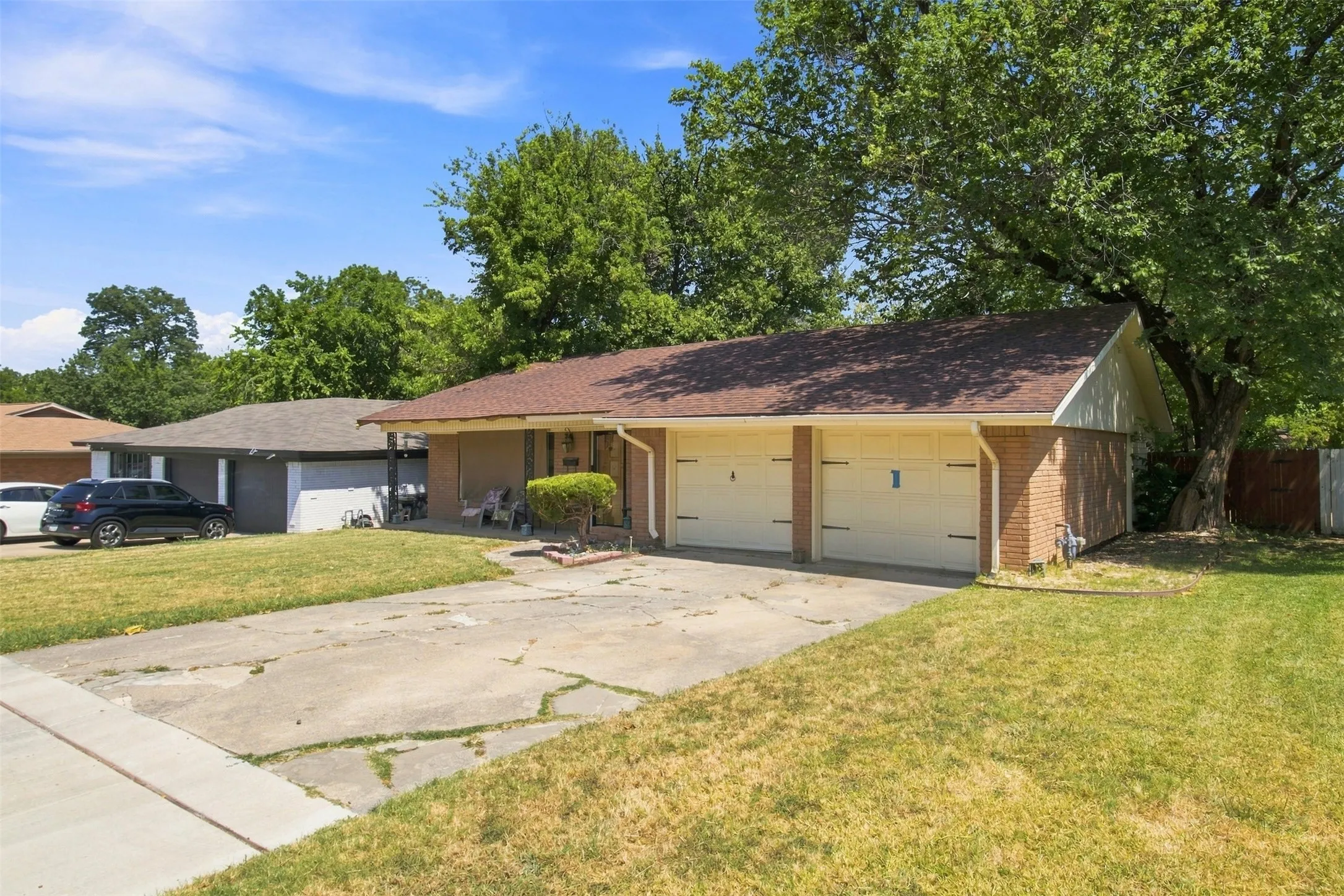 Brick-sided exterior with a two-car garage