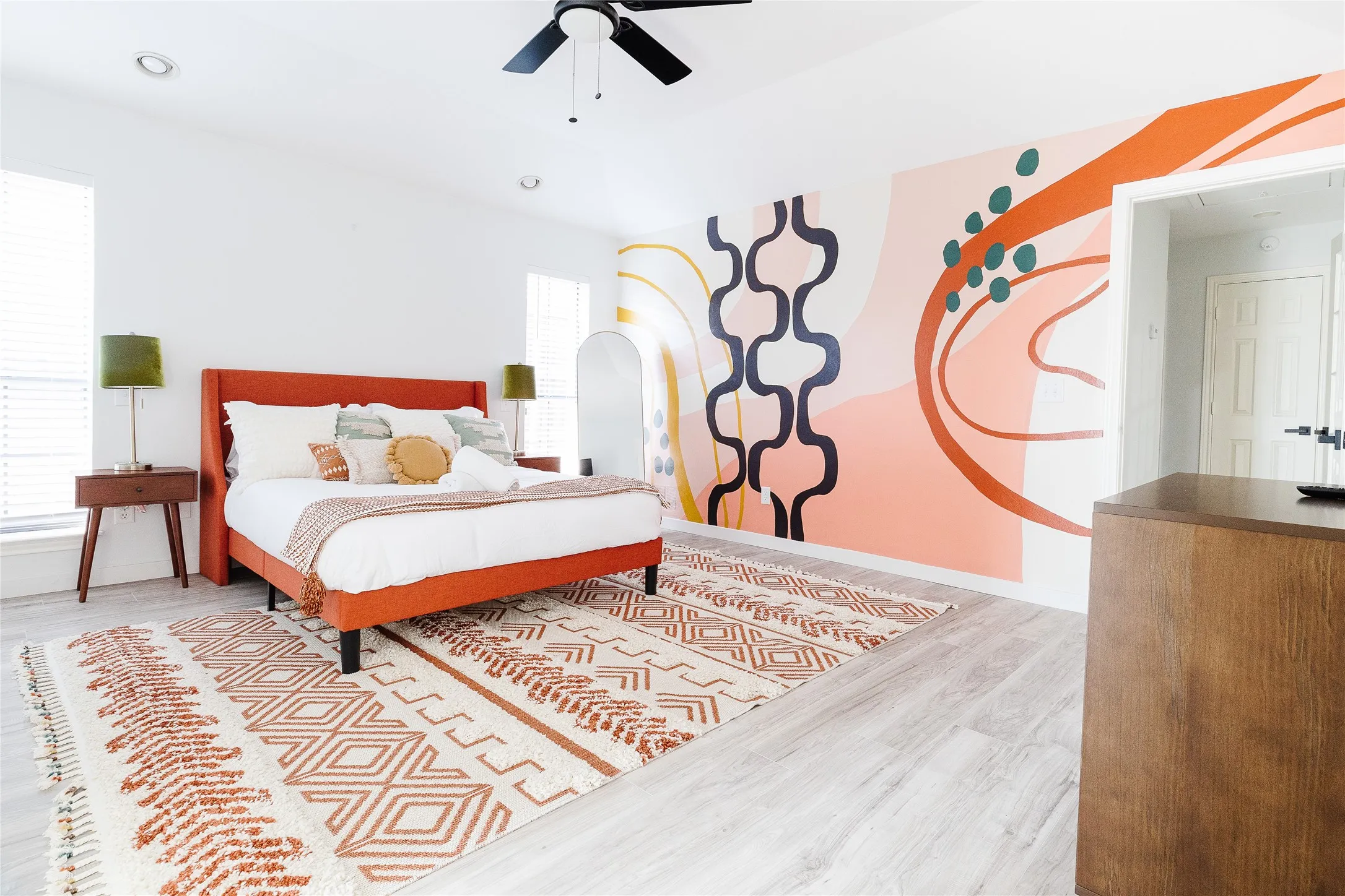Recessed lighting, ceiling fan, decorative accent wall, light wood-finish flooring, and white window blinds