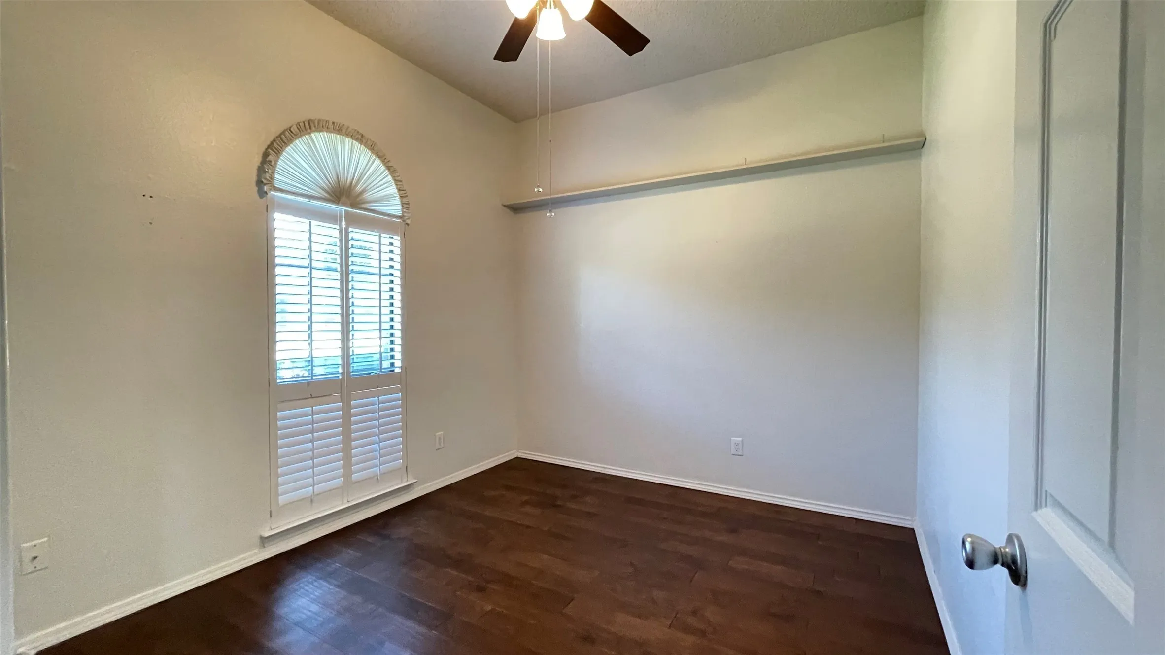Bedroom 3 with ceiling fan, hardwood floor