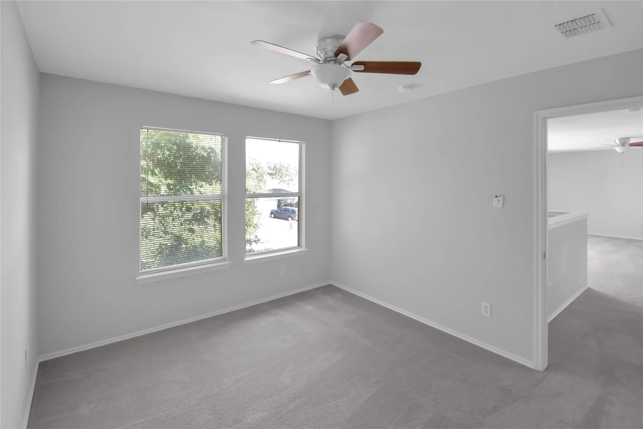 Recessed lighting and ceiling fan with wood-finish blades