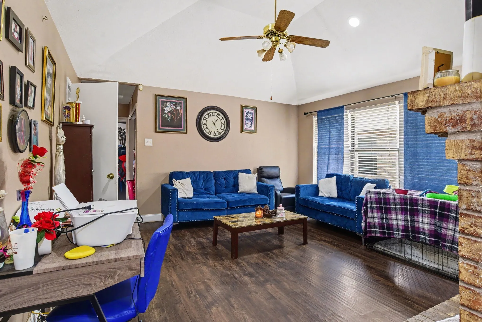 Alternate living room angle highlighting bright natural lighting and seamless flow into adjoining spaces.