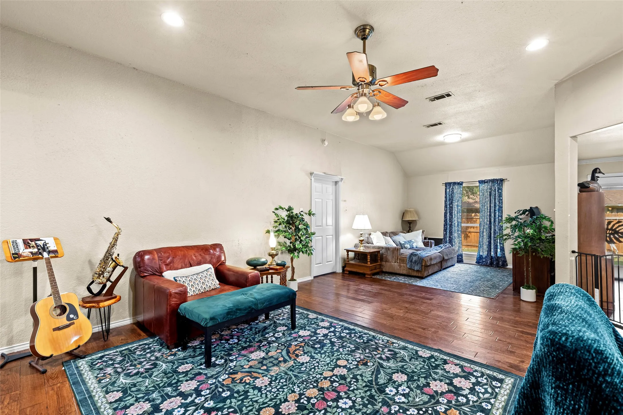 From entry way looking into living room and formal dining area to the back utilized as an extended living space.
