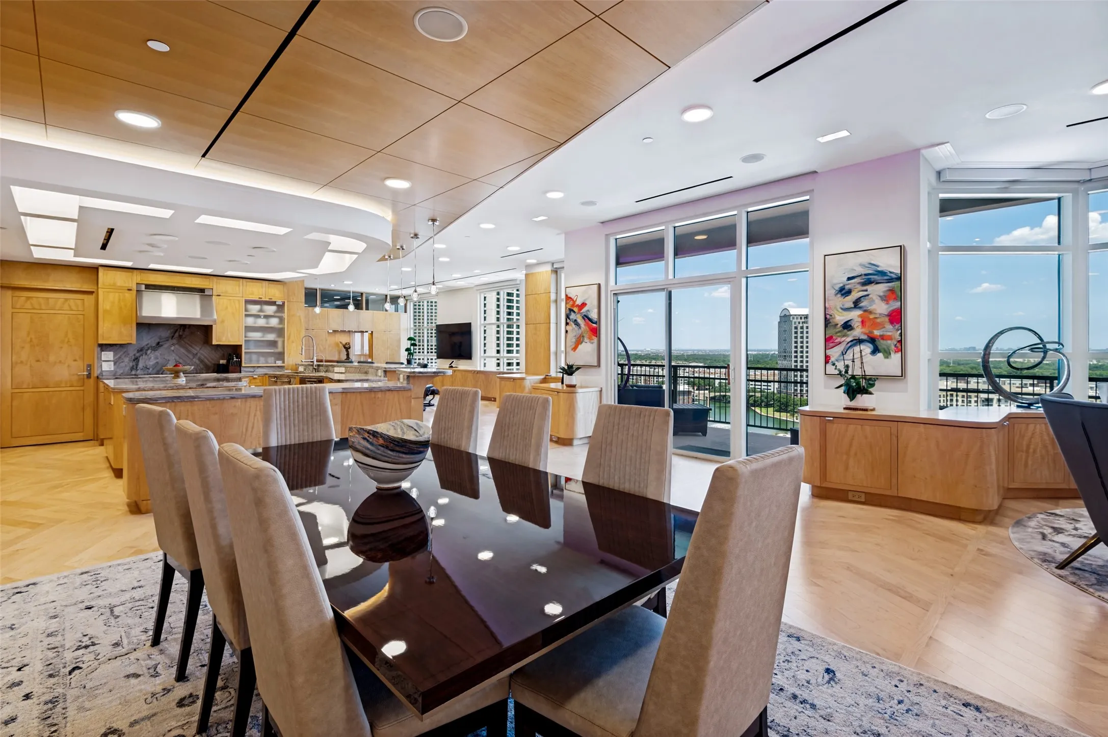 Integrated dining and kitchen area with wood-finish flooring
