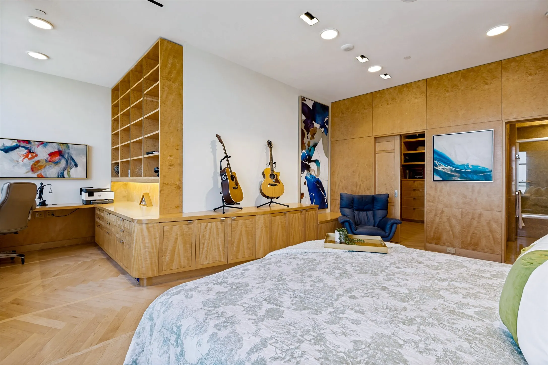 Wood-finish flooring, built-in shelving, integrated desk, recessed lighting, and wood-paneled walls
