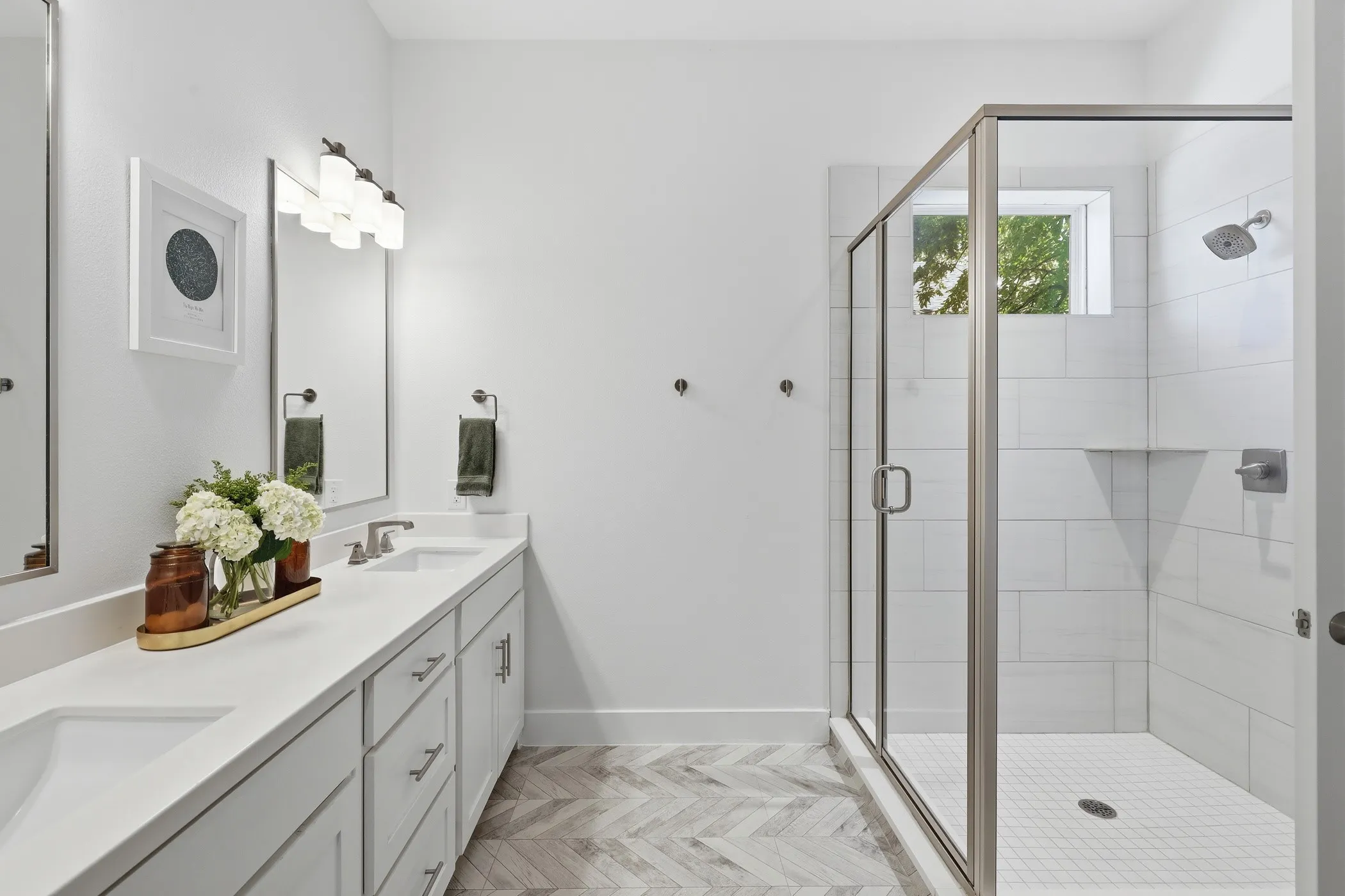 Dual vanity with undermount sinks and light-toned countertops