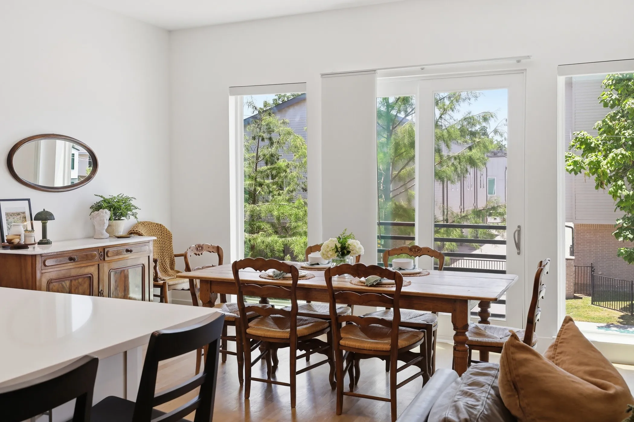 Dining area featuring wood-finish flooring and extensive natural light from multiple windows