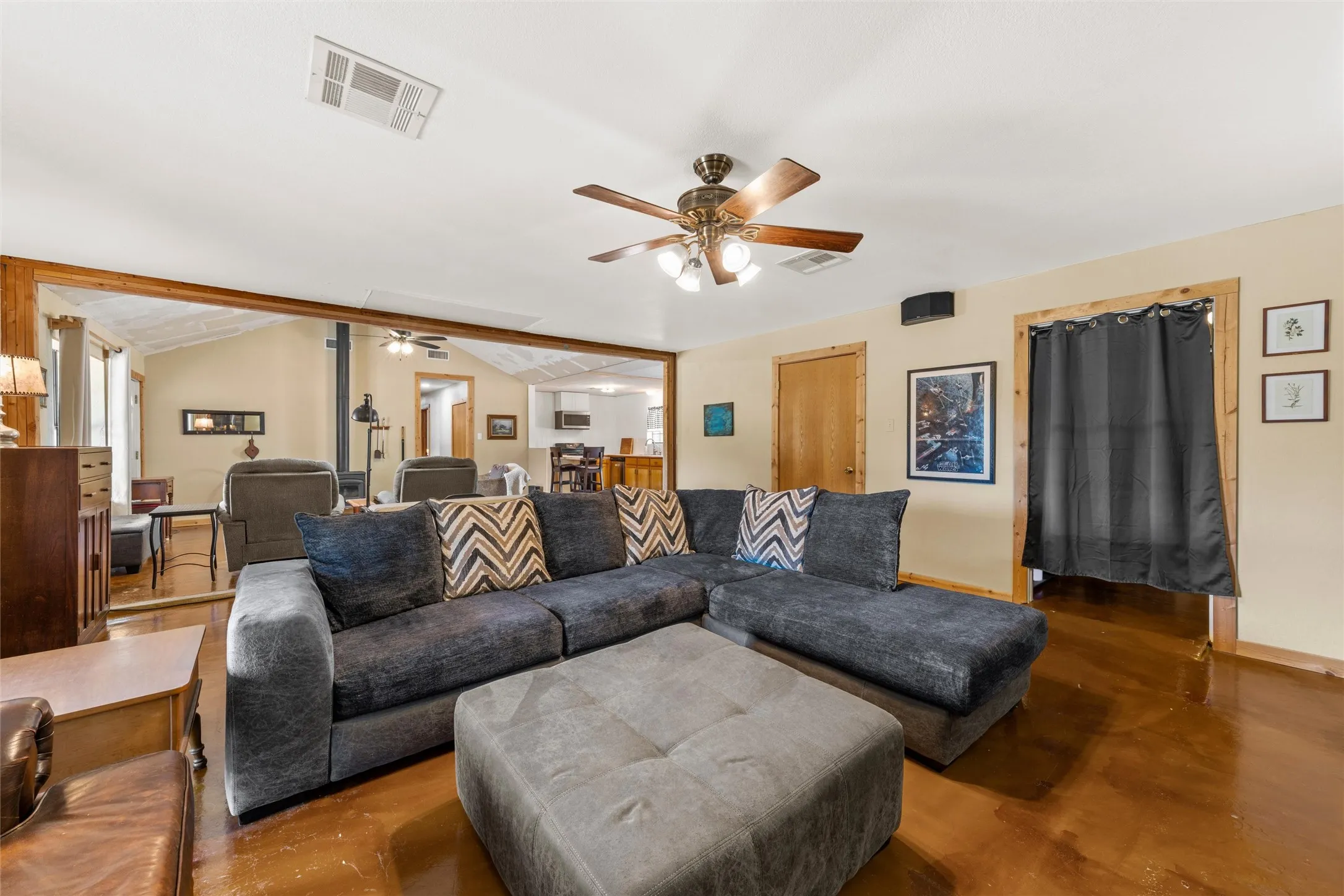 Wood-finish flooring, ceiling fan, and recessed lighting