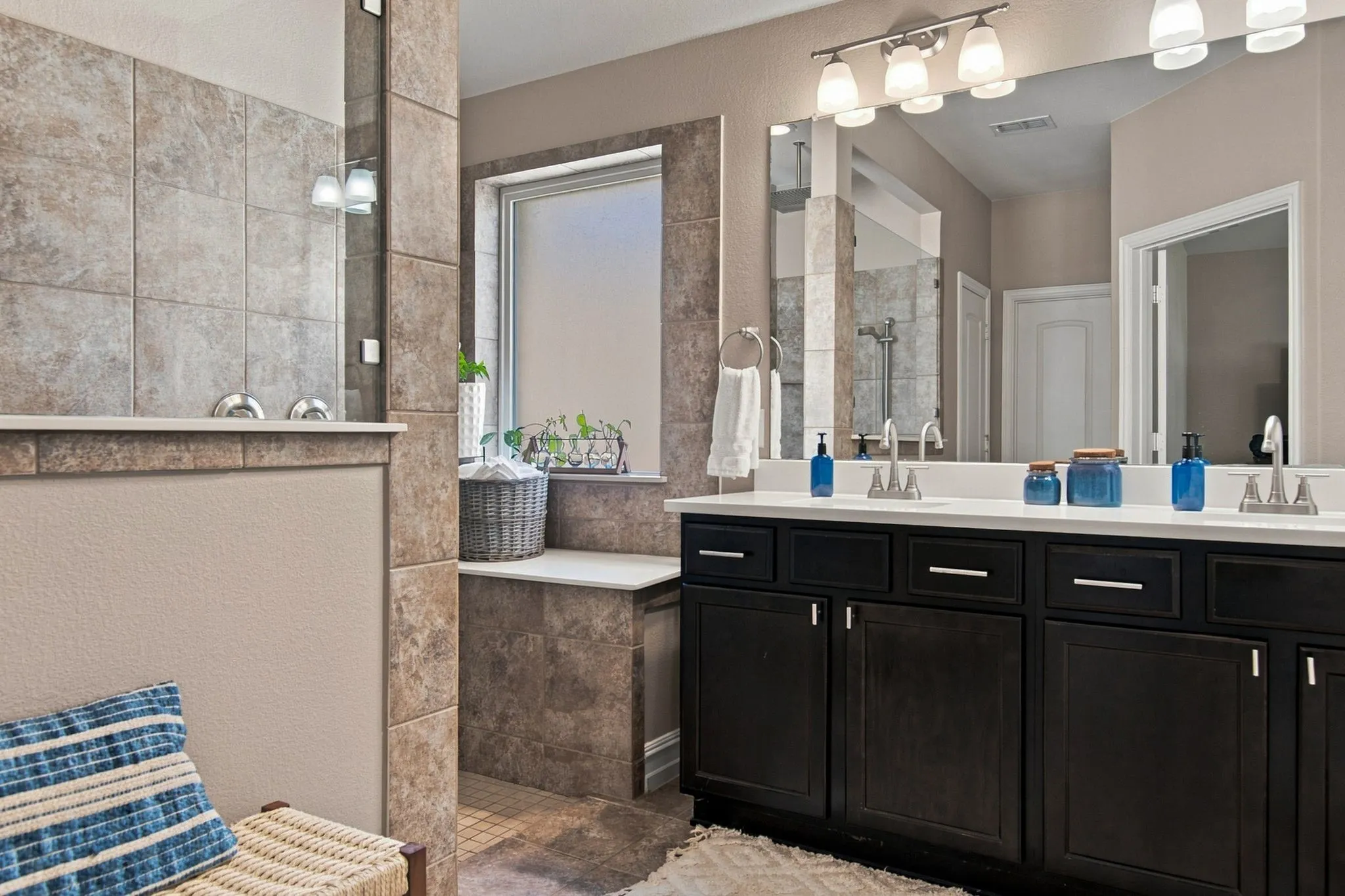 Wait till you see the rest of this!  The primary bath makes you feel like you are at a spa!  Countertops were recently replaced.