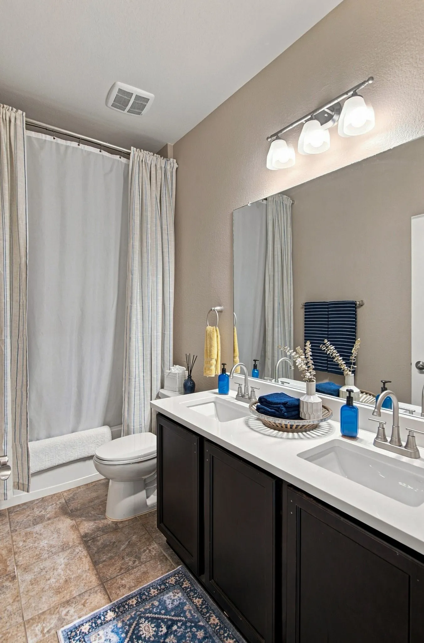 Hall bath has two sinks and countertop was recently replaced.