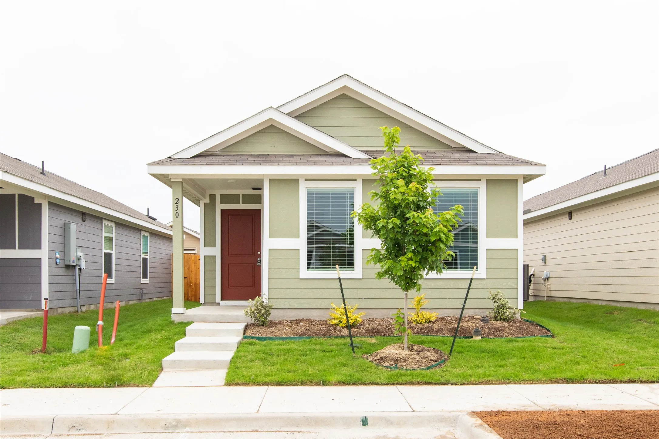 Bungalow with a front lawn