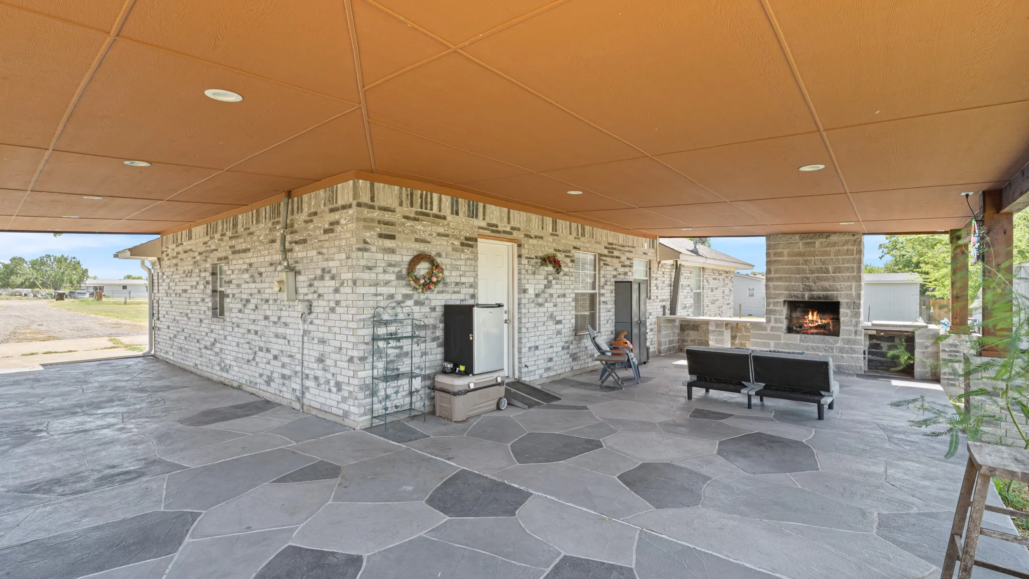 Carport and patio flow together.