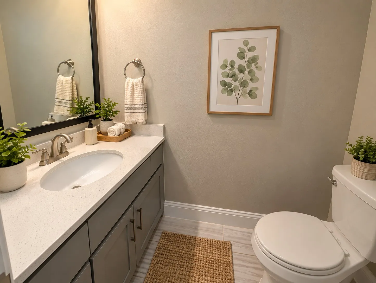 Vanity with light-colored countertop, undermount sink, and brushed nickel faucet