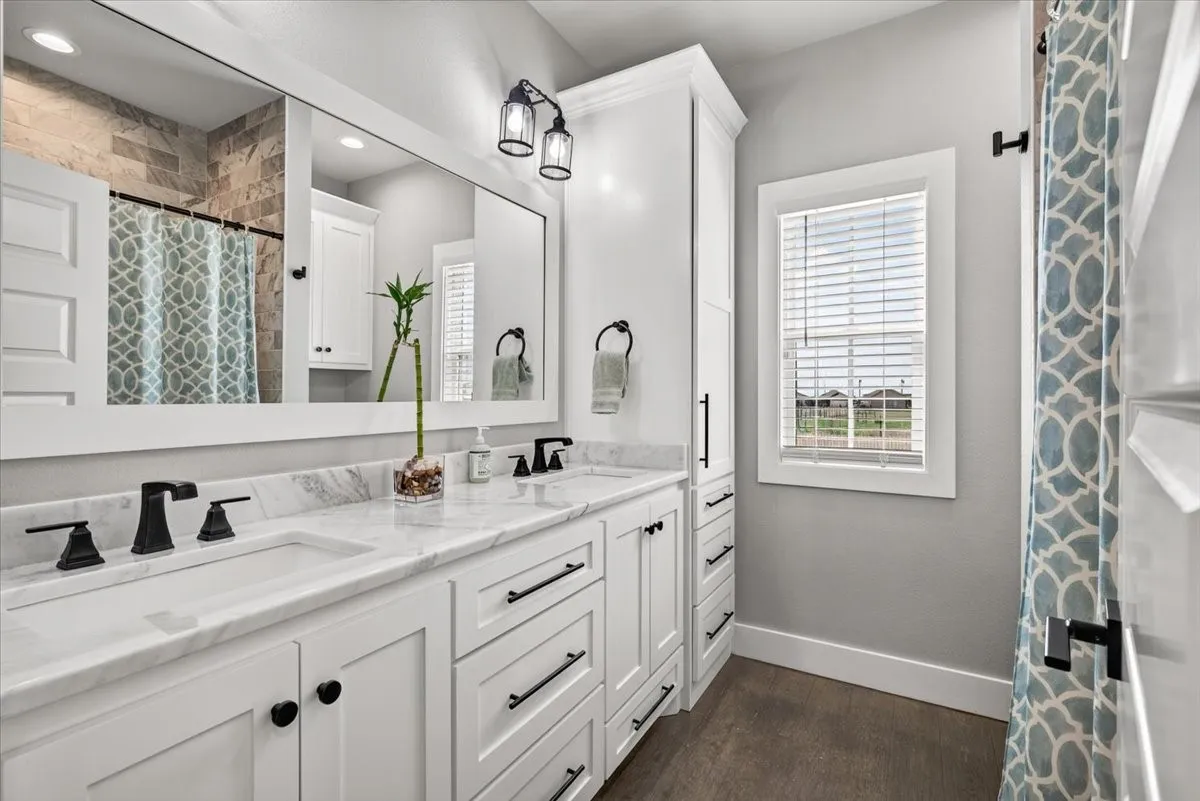 guest bathroom with duel sinks