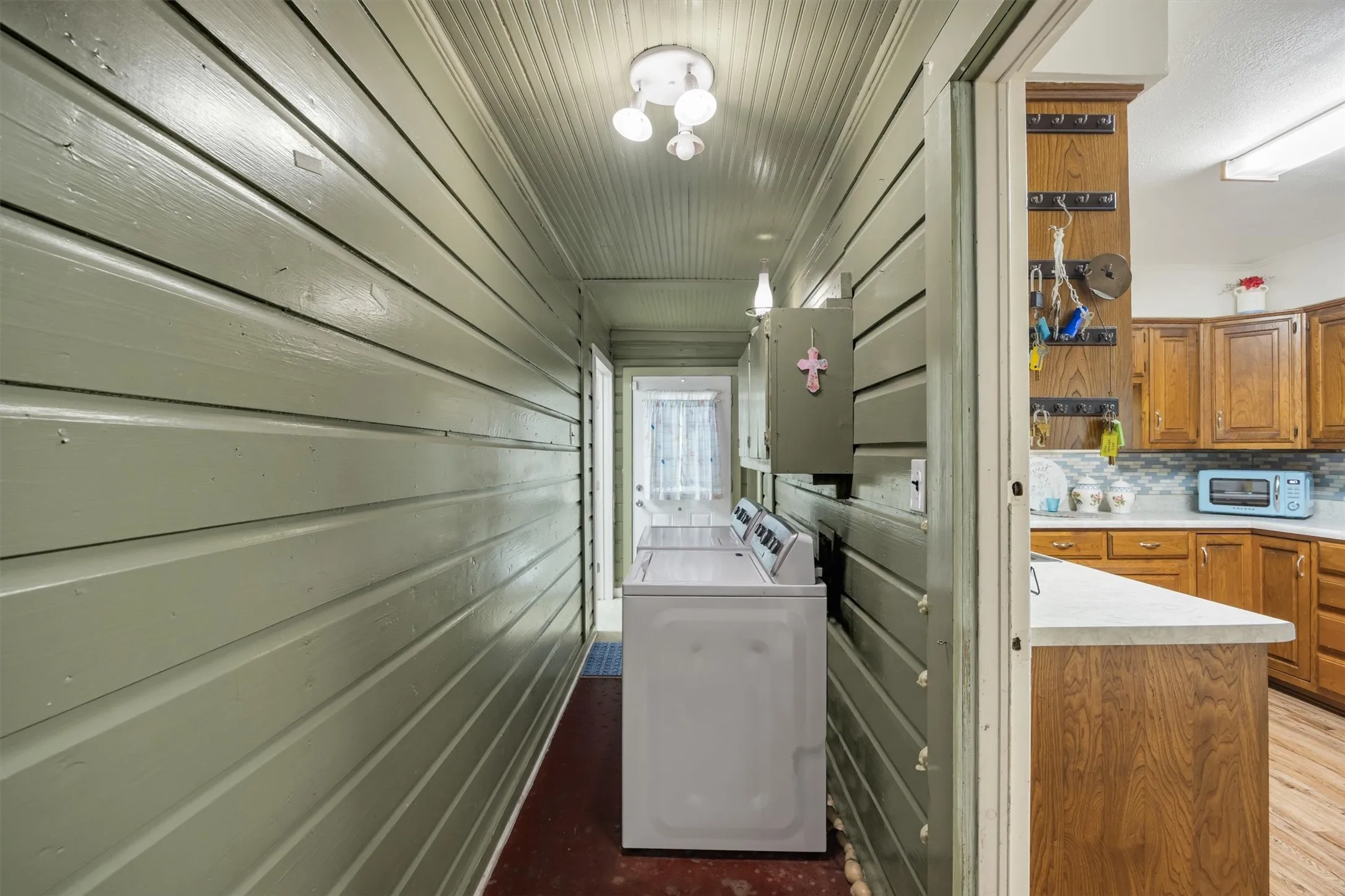 Breezeway from driveway front door entrance that leads to second bedroom, bathroom and back yard.