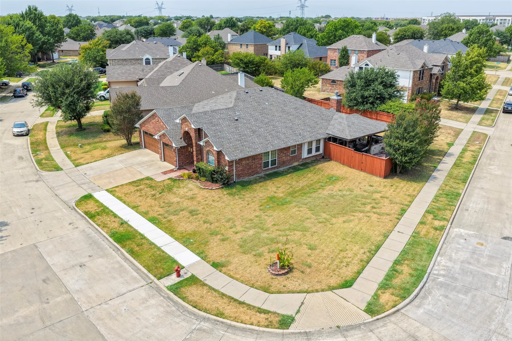 Brick exterior with an attached THREE-car garage