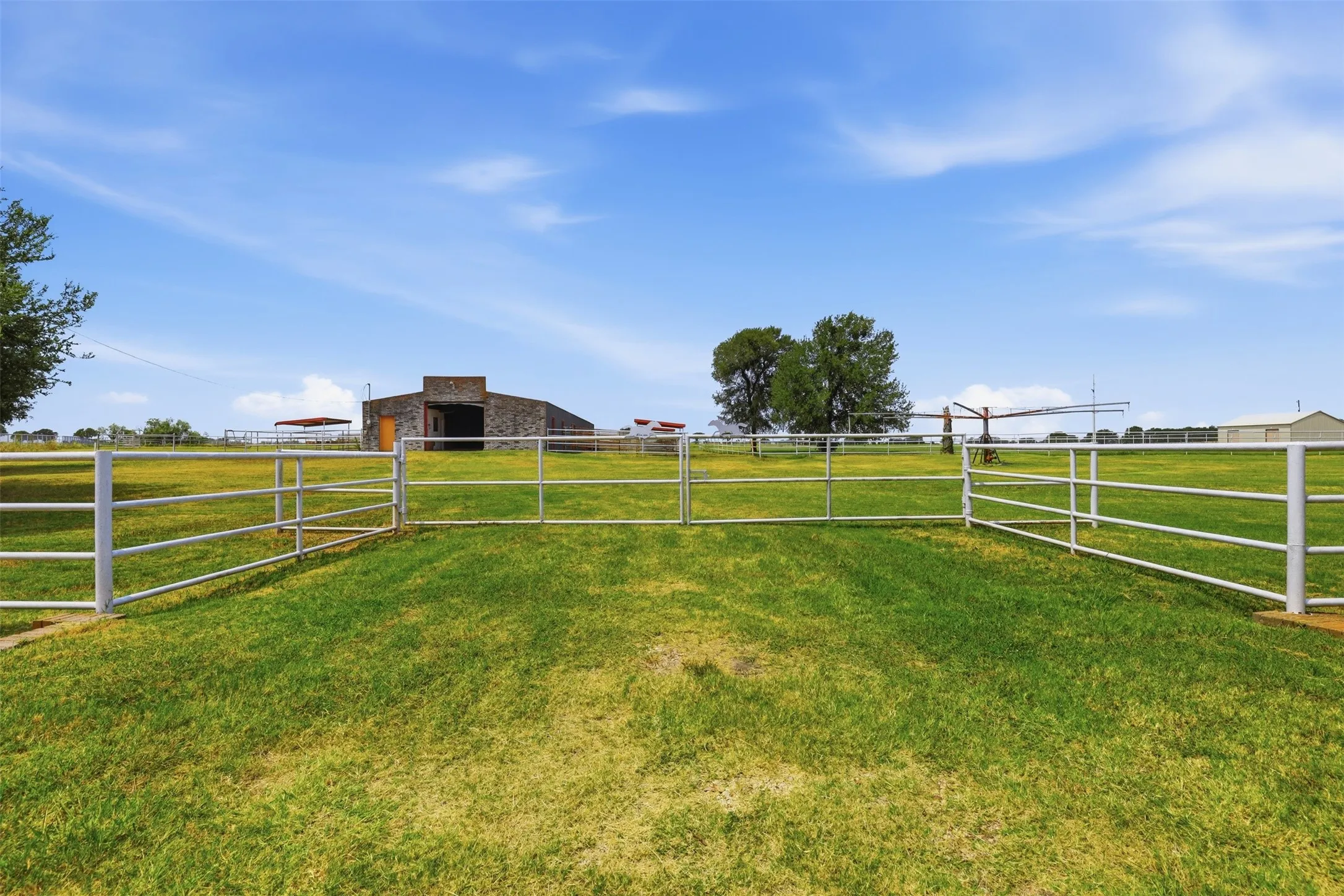 One of two entry gates at front of property.