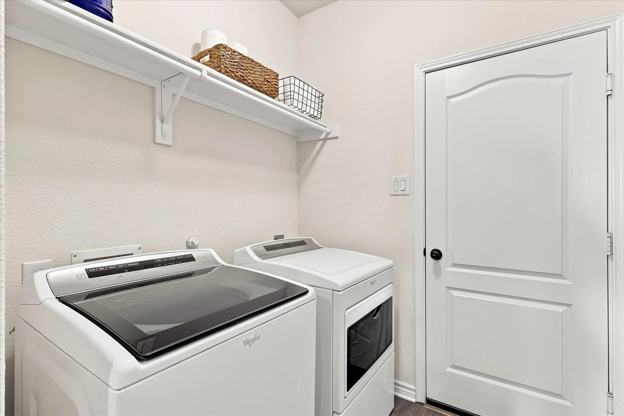 Wall-mounted shelving provides storage