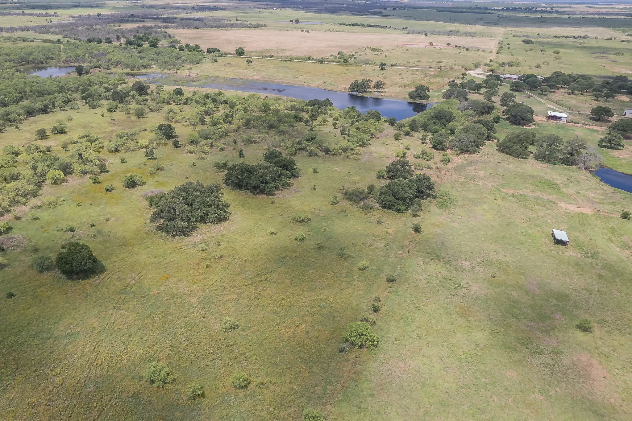 Aerial view with a water view and a rural view