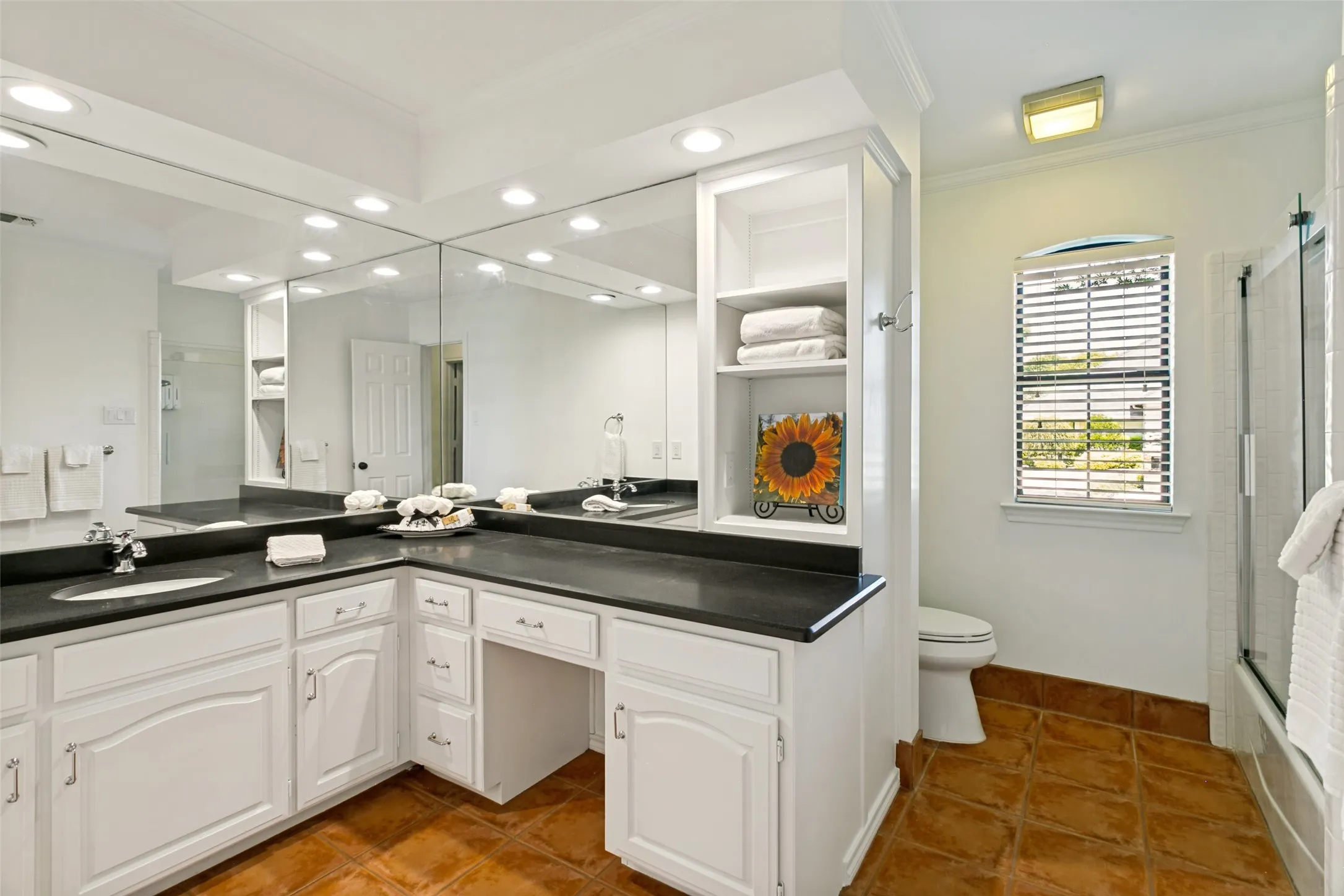 Second bathroom is large, light and bright with honed granite countertops.  It is conveniently located by bedroom #2 and #3.
