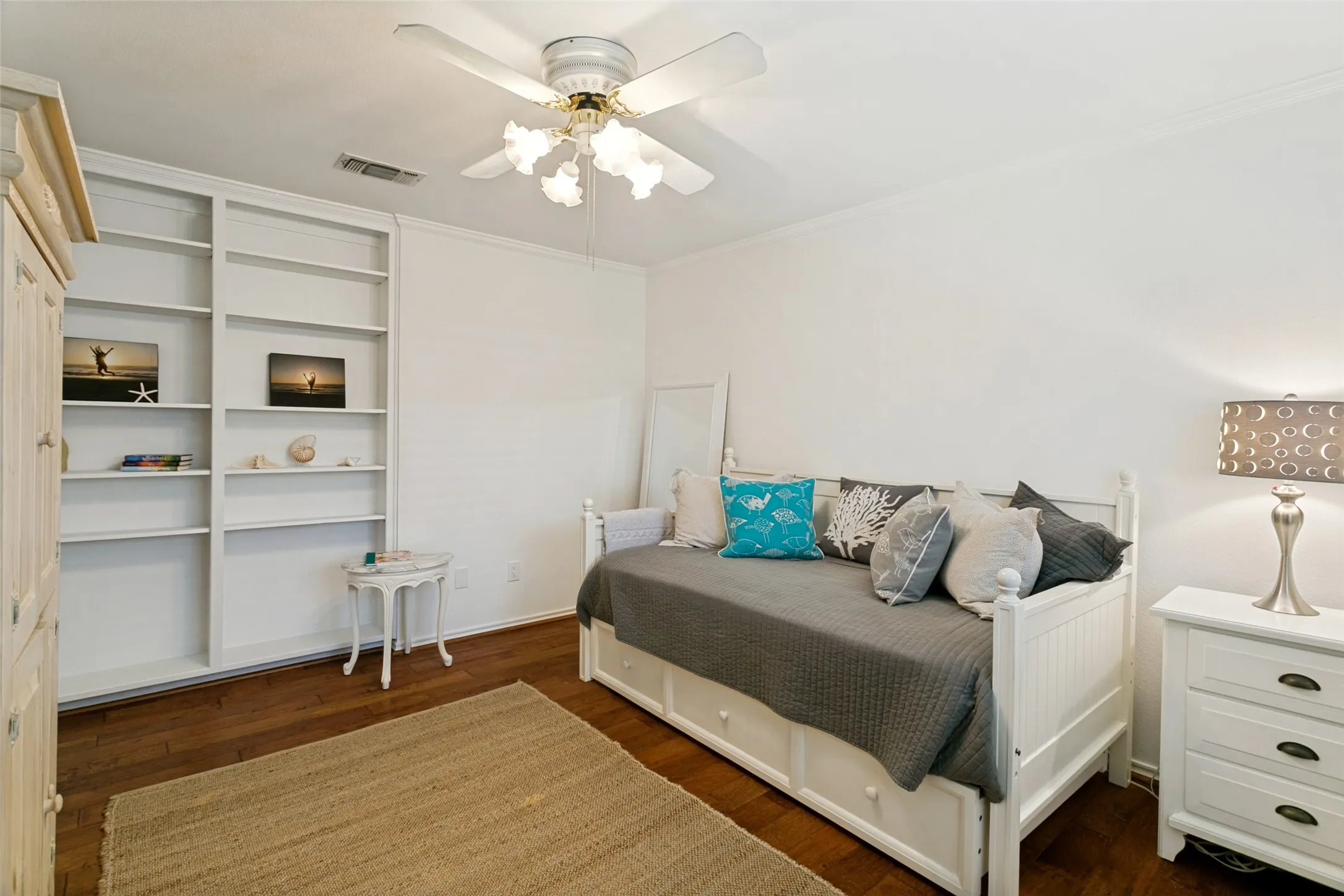 Third bedroom is light and bright with additional built-in shelving.