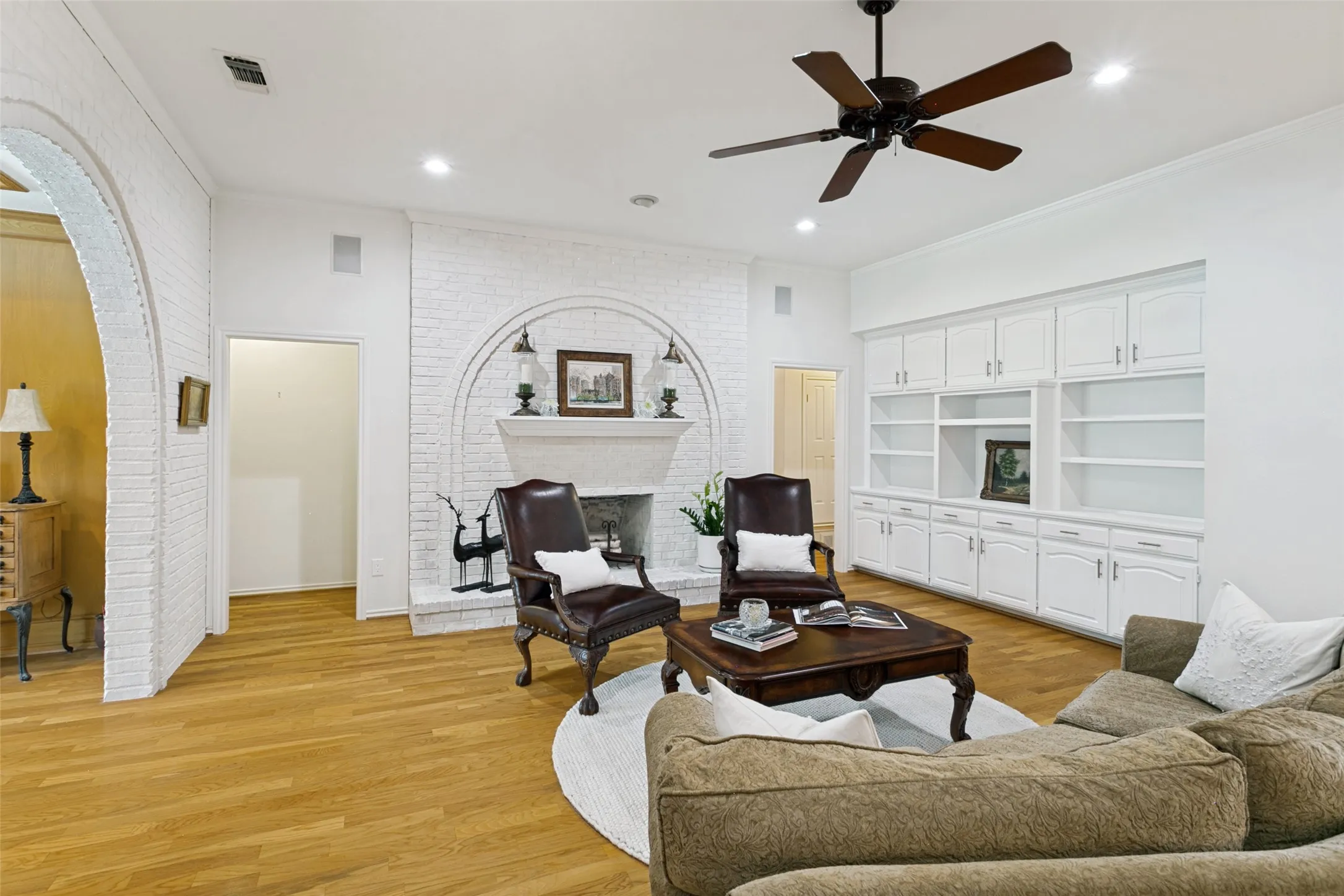 Notice the fireplace and the wall of bookcases to house your favorite books or display decorative items.