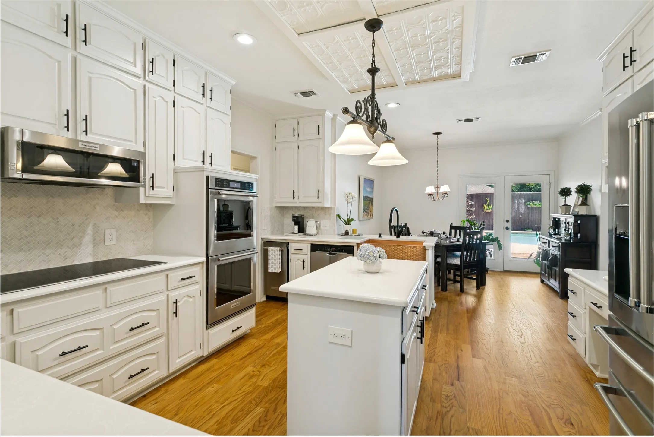 Beautifully renovated kitchen with expansive counterspace and storage galore