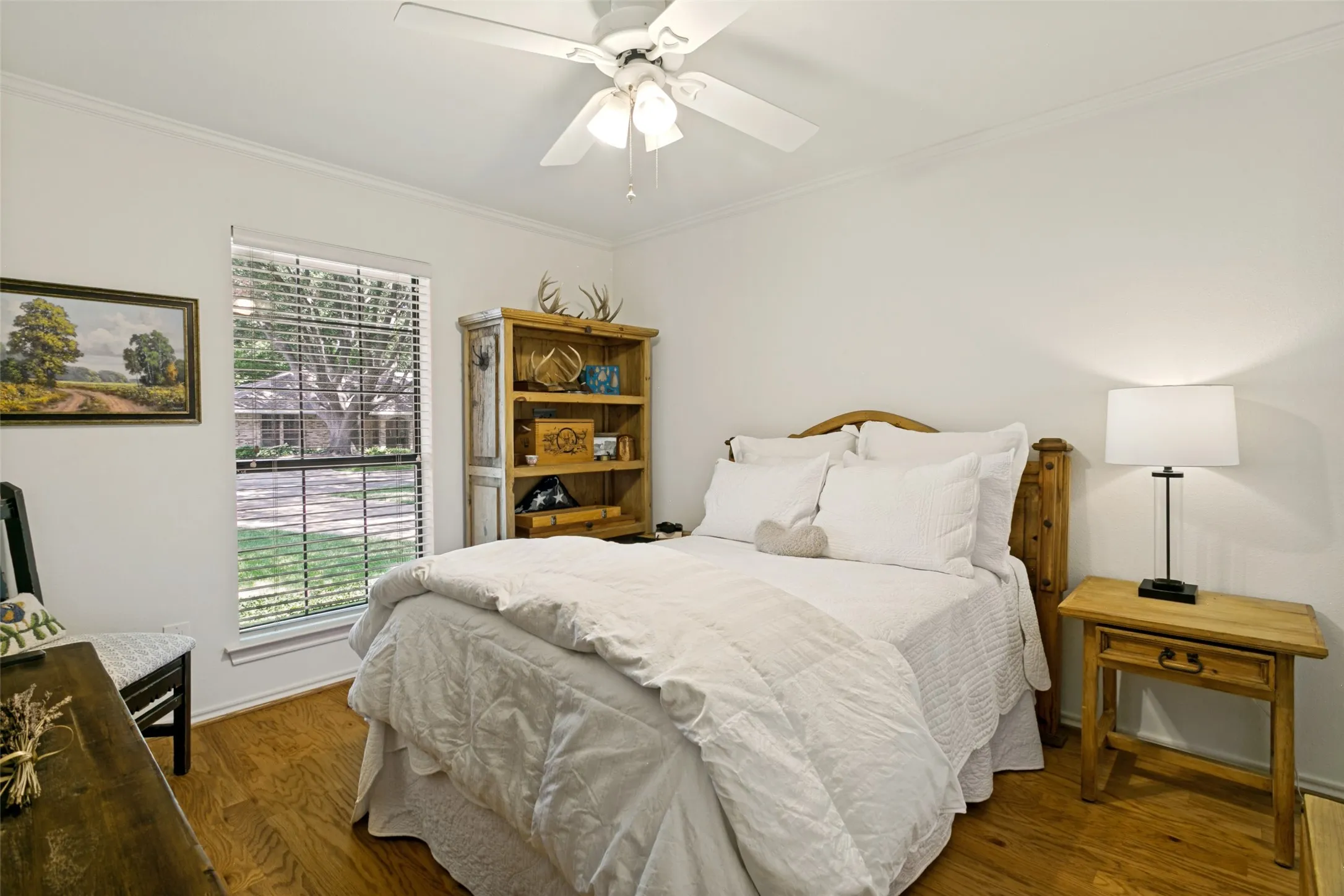 A fourth bedroom, privately situated on the opposite side of the home, offers added flexibility and privacy.
